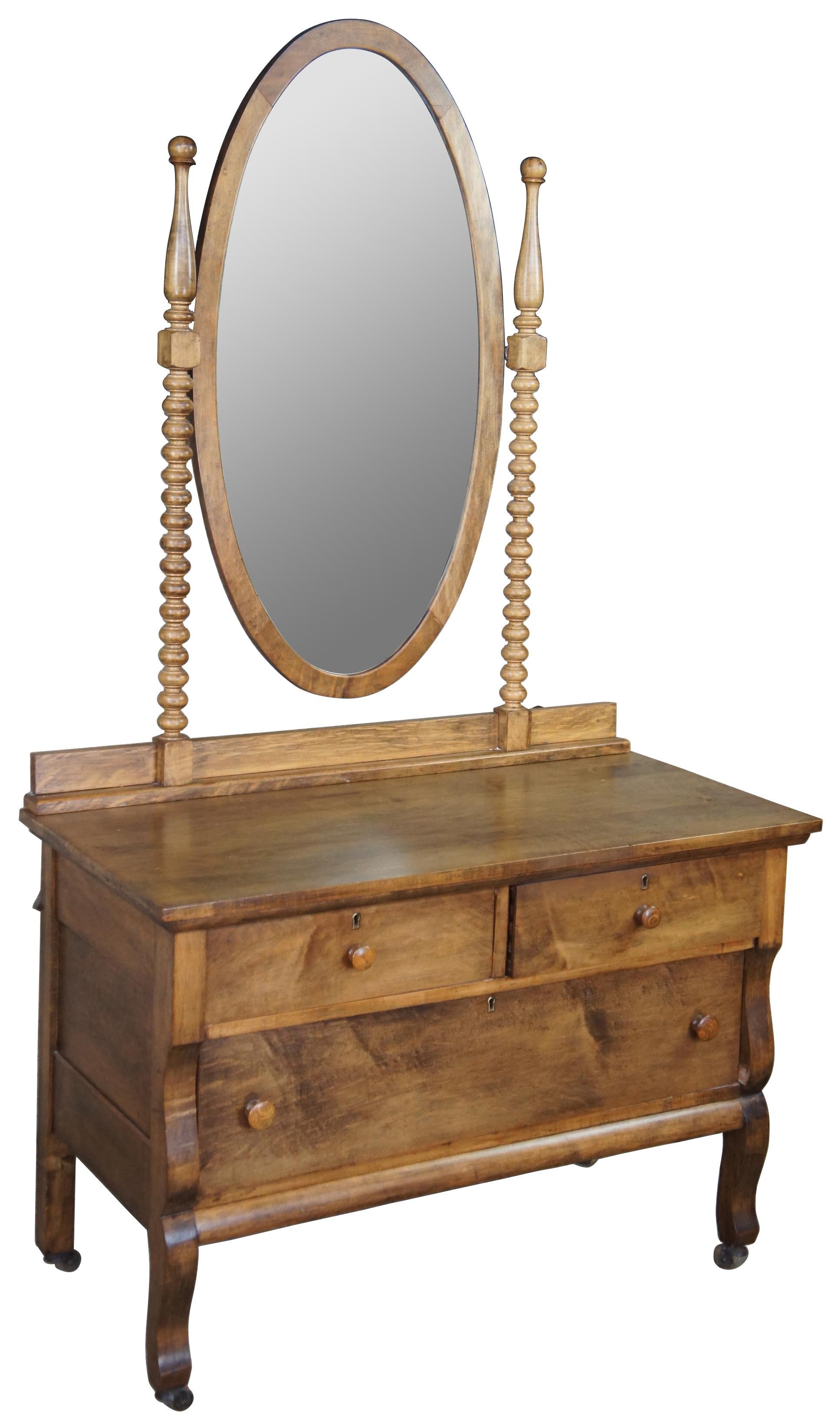 Late Victorian Crescent Line lowboy vanity dresser or chest. Made of oak featuring a tall oval mirror with ribbed supports over two large drawers. Circa 1900s

Measures: 40