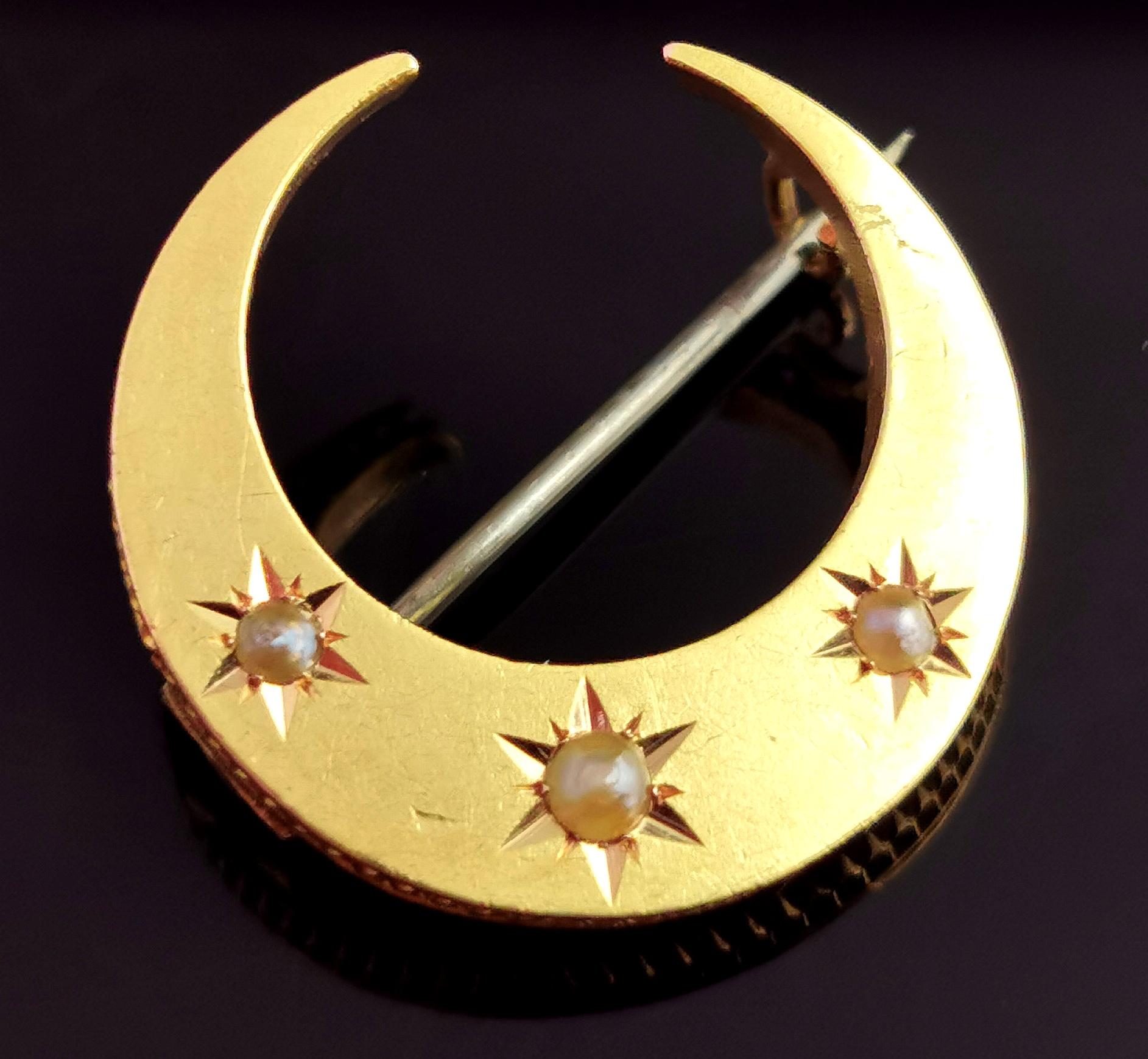 A very pretty late Victorian, 15kt gold pearl set crescent brooch.

A beautiful curved rich gold moon, star set with three split pearls.

Crescent moons were a popular motif in Victorian and later Edwardian jewellery, they are attributed to a number