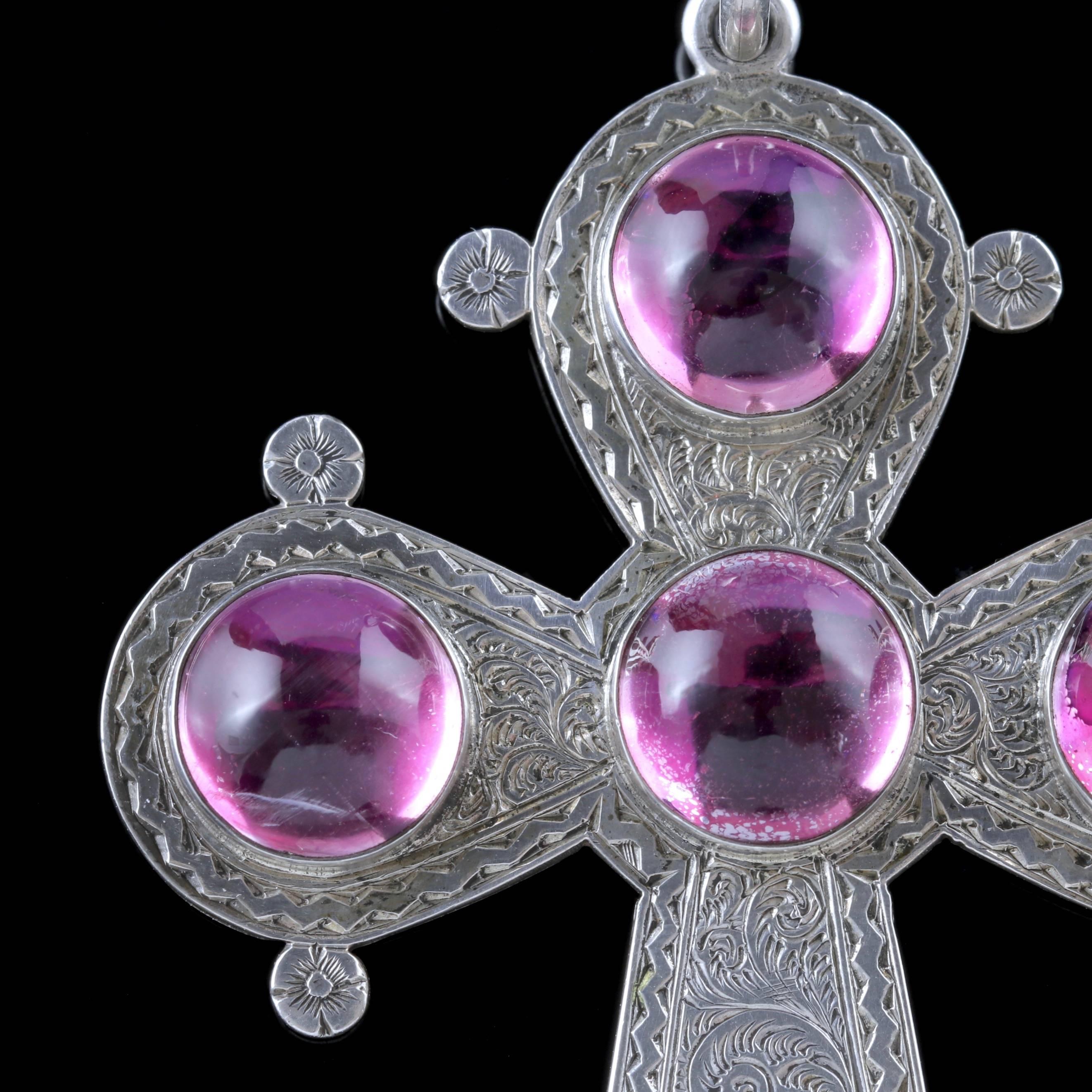 To read more please click continue reading below-

This magnificent antique Victorian Silver cross pendant is Circa 1900.

The wonderful piece is adorned with five beautiful cabochon Rock Crystal stones which are backed with violet foil to simulate