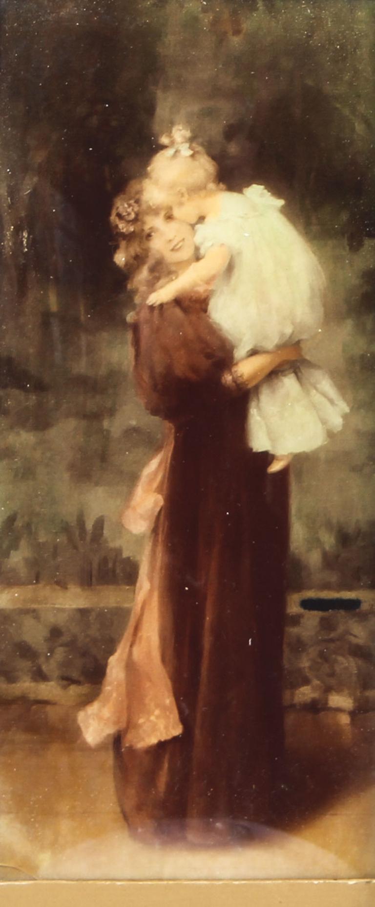 This is a charming antique Victorian crystoleum print on concave glass, late 19th century in date.
 
It depicts a young mother dressed in Georgian period costume holding her daughter, set in a classical backdrop. 
 
The picture is framed in a
