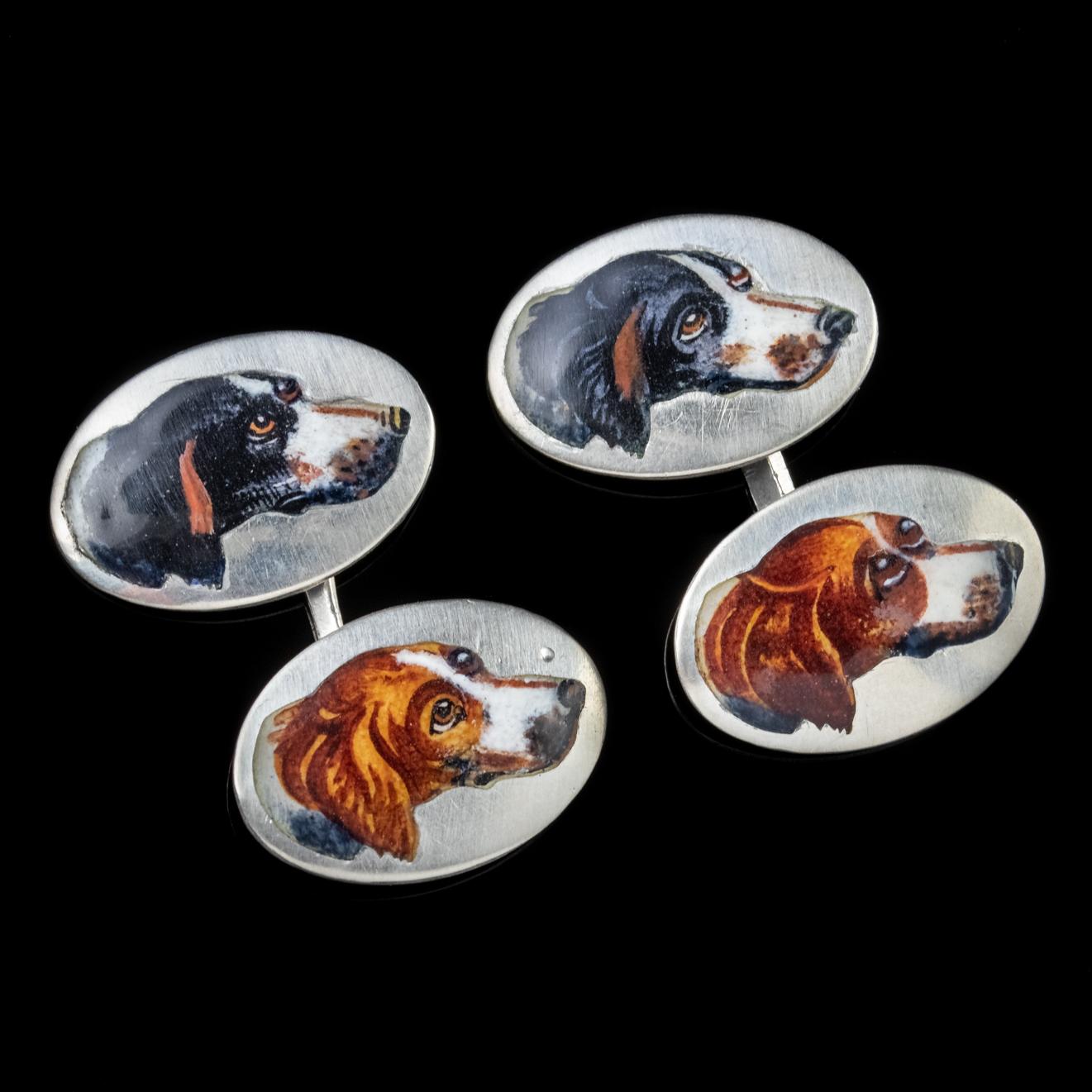 A lovely pair of Antique Victorian double cufflinks featuring detailed Enamel portraits of two Spaniels, one white and brown, the other black and white with adorable big eyes and floppy ears. 

Victorian jewellery mirrored Queen Victoria’s life with