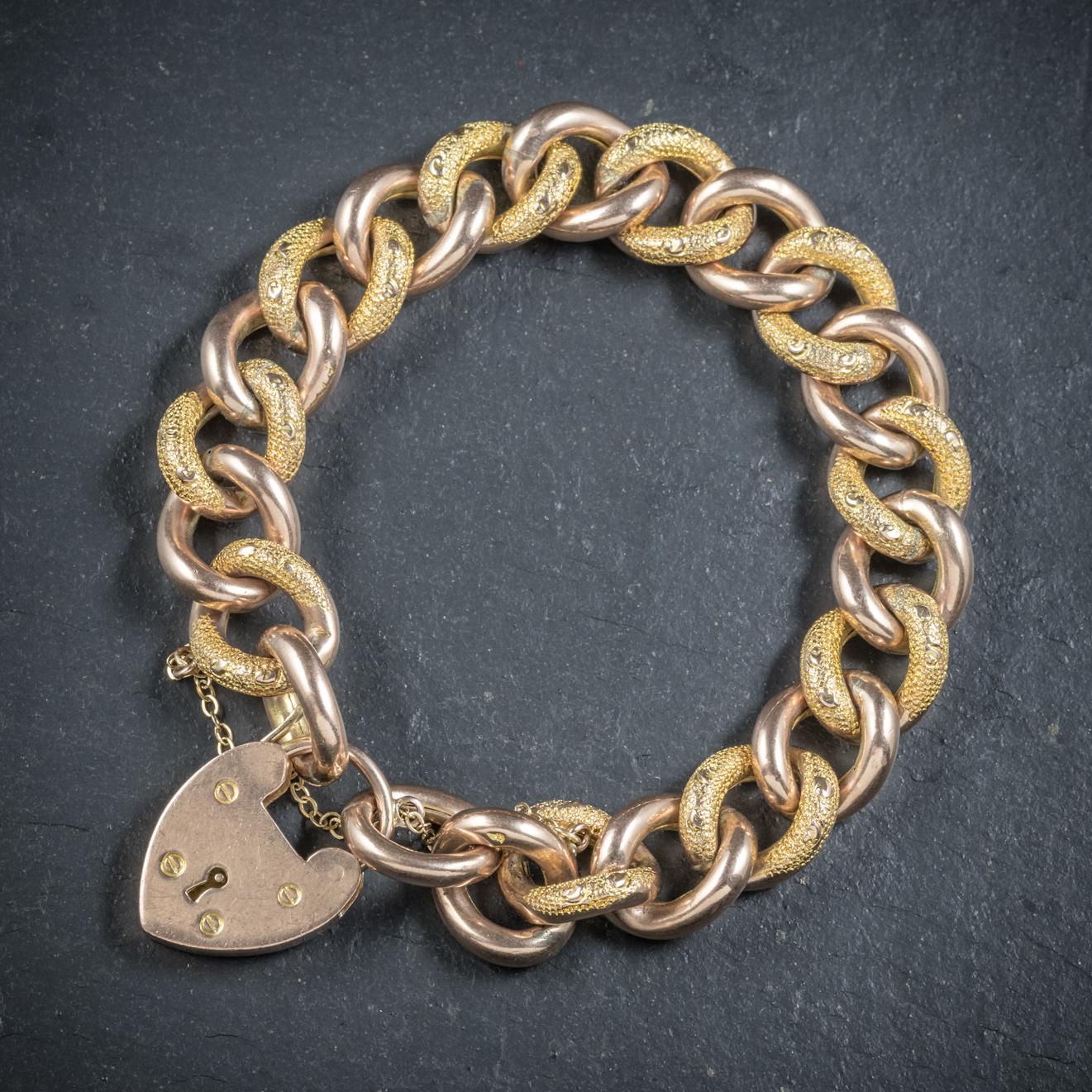 This lovely 9ct Yellow Gold curb bracelet is Victorian Circa 1900

The piece consists of chased/ plain links which are stamped 9ct underneath and have turned a lovely rosy hue with age

Held together by a fabulous heart Padlock which is hallmarked