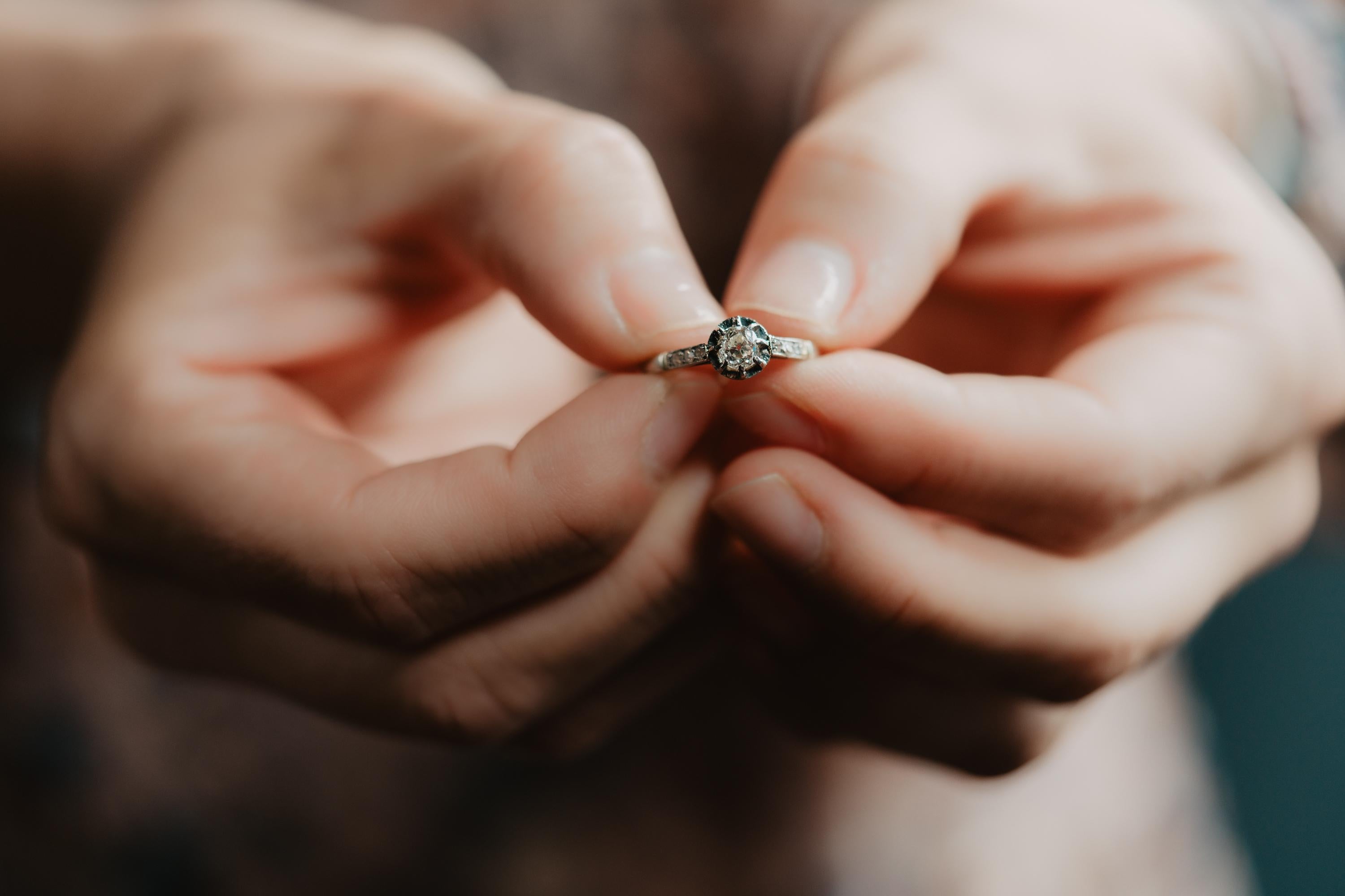 A very rare antique French engagement ring featuring a circa 0.5 carat old cushion cut diamond. The diamond has a good clarity and color and is set in 8 elegant prongs. “The Cushion