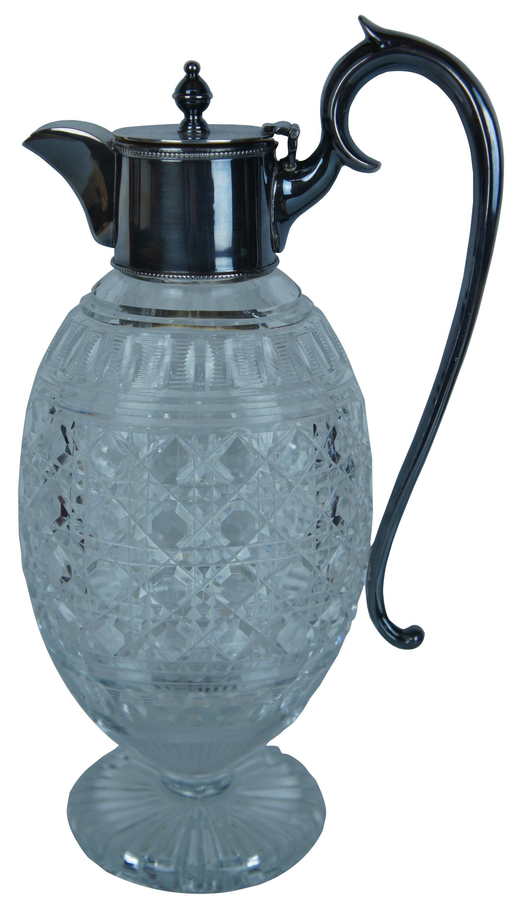 Antique Victorian claret jug or pitcher. Made of crystal featuring a wheel cut pattern with silver plated handle, lid and spout. These jugs became popular in the 19th century for use to serve claret, a dry red wine produced in France's famous