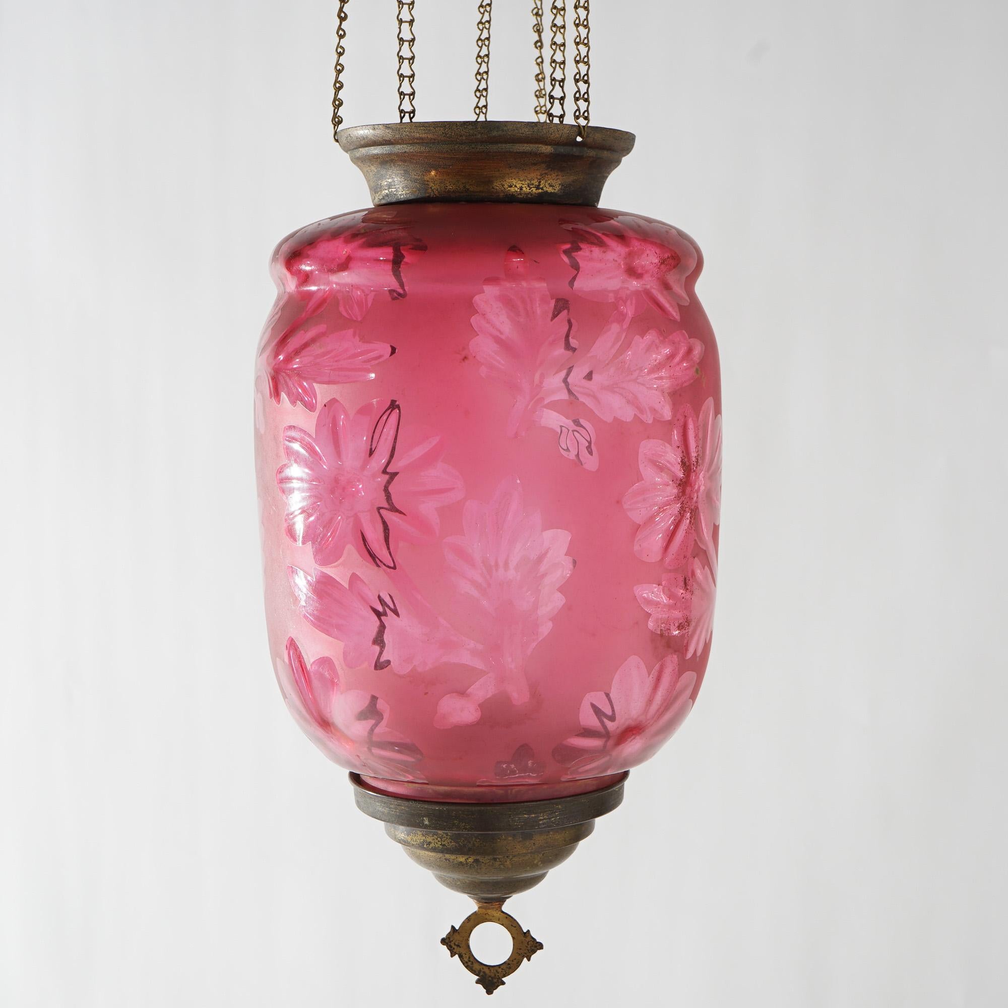 An antique Victorian hanging pendant hall light offers brass frame with cut to clear cranberry glass shade with flowers, c1880

Measures - 31