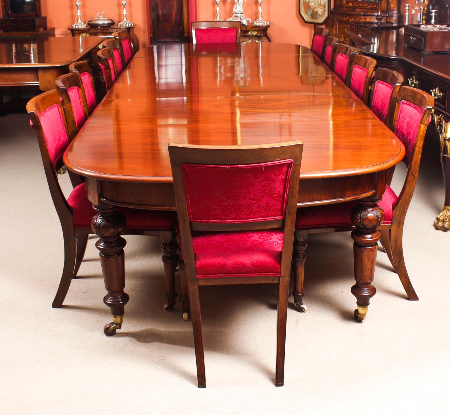 This is a fantastic dining set comprising an antique Victorian solid mahogany D-end dining table with a set of fourteen antique upholstered back dining chairs, all circa 1870 in date.

The beautiful table is in stunning flame mahogany and has four
