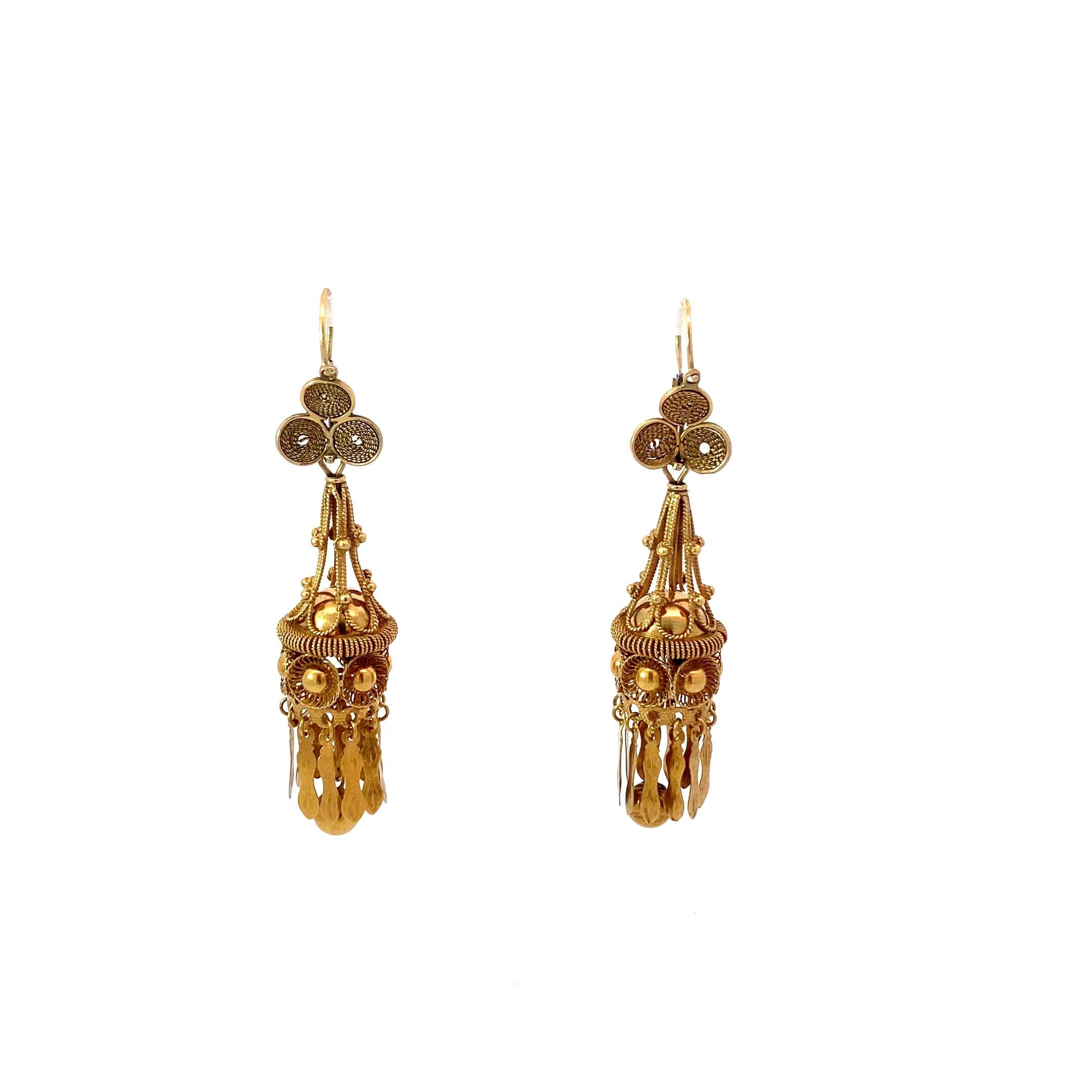 unique convertible earrings dating from the Victorian period. These 15k gold earrings feature a great amount of detail work. The chandelier drops are detachable from the lever back earring giving you two ways to wear this special piece. The tassel