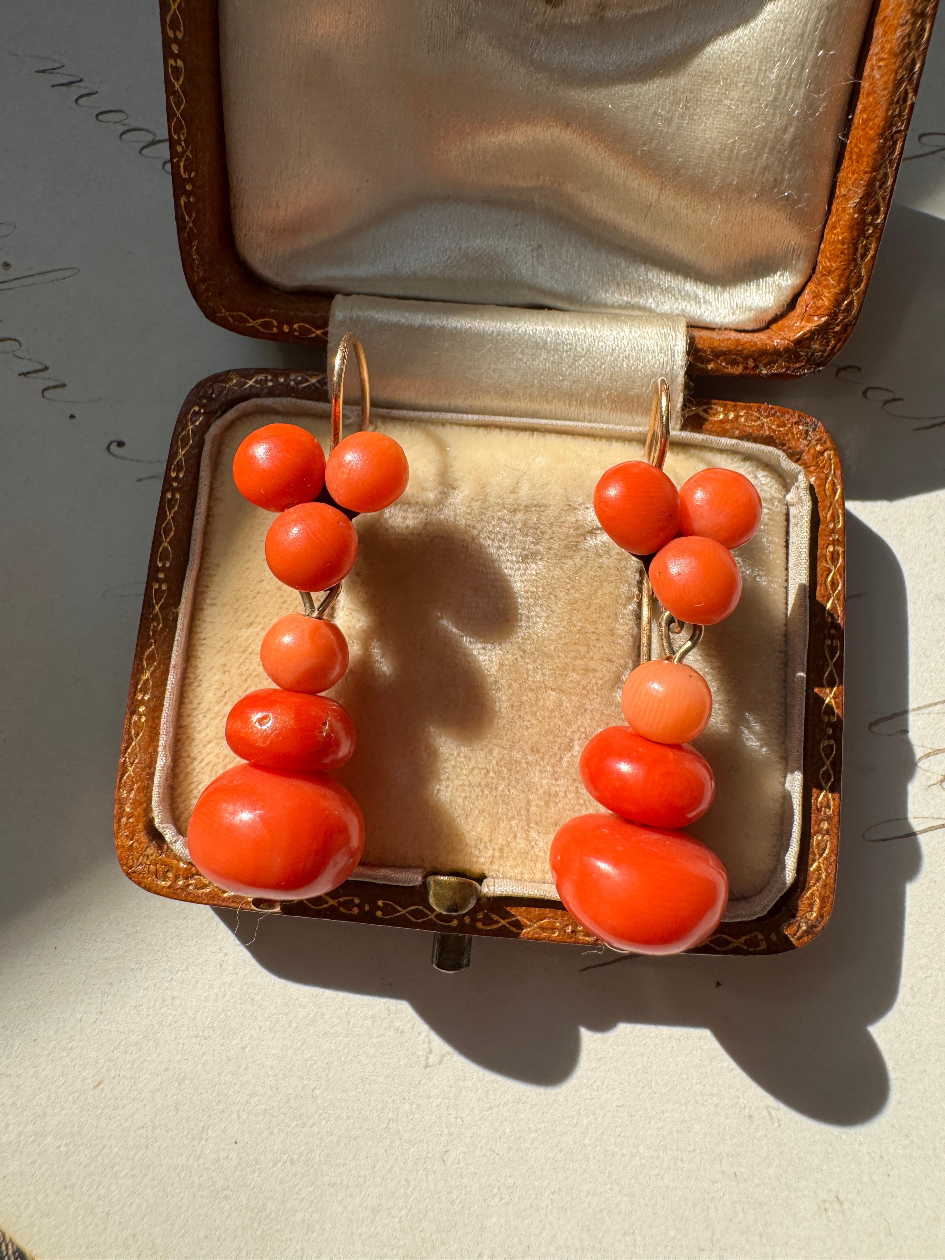These Victorian day-to-night earrings swing and sway with a detachable coral tops that gracefully suspend a larger coral drop. These lovely ladies measure 1.5