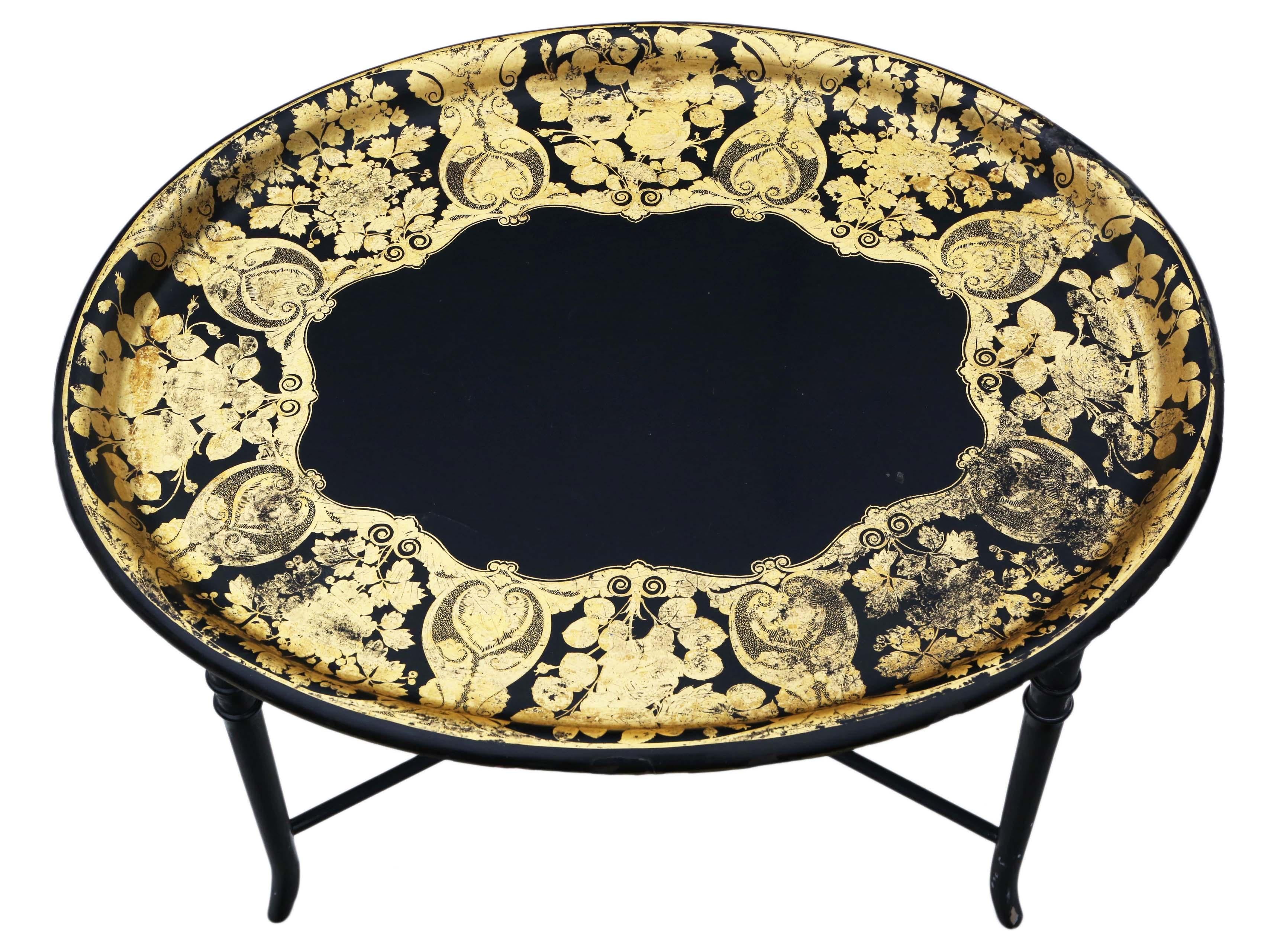 Victorian gilt decorated black lacquer tray on later stand. Dates from circa 1880.
 
Would make a great coffee table. Solid, no loose joints.
A great quality tray.

Very attractive, with lovely proportions and styling. No woodworm.

Lovely