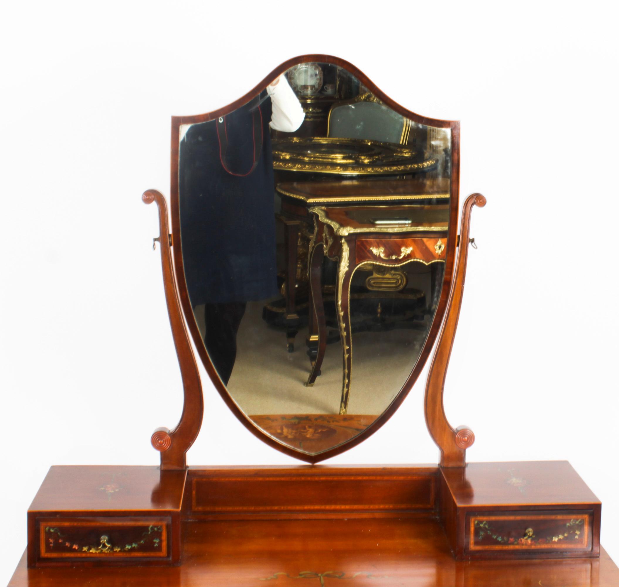 This is a totally fabulous antique late Victorian hand painted dressing table, Circa 1880 in date.
 
The mahogany dressing table features satinwood cross banding and hand painted decoration in the manner of Angelica Kauffman, of playful cherubs,