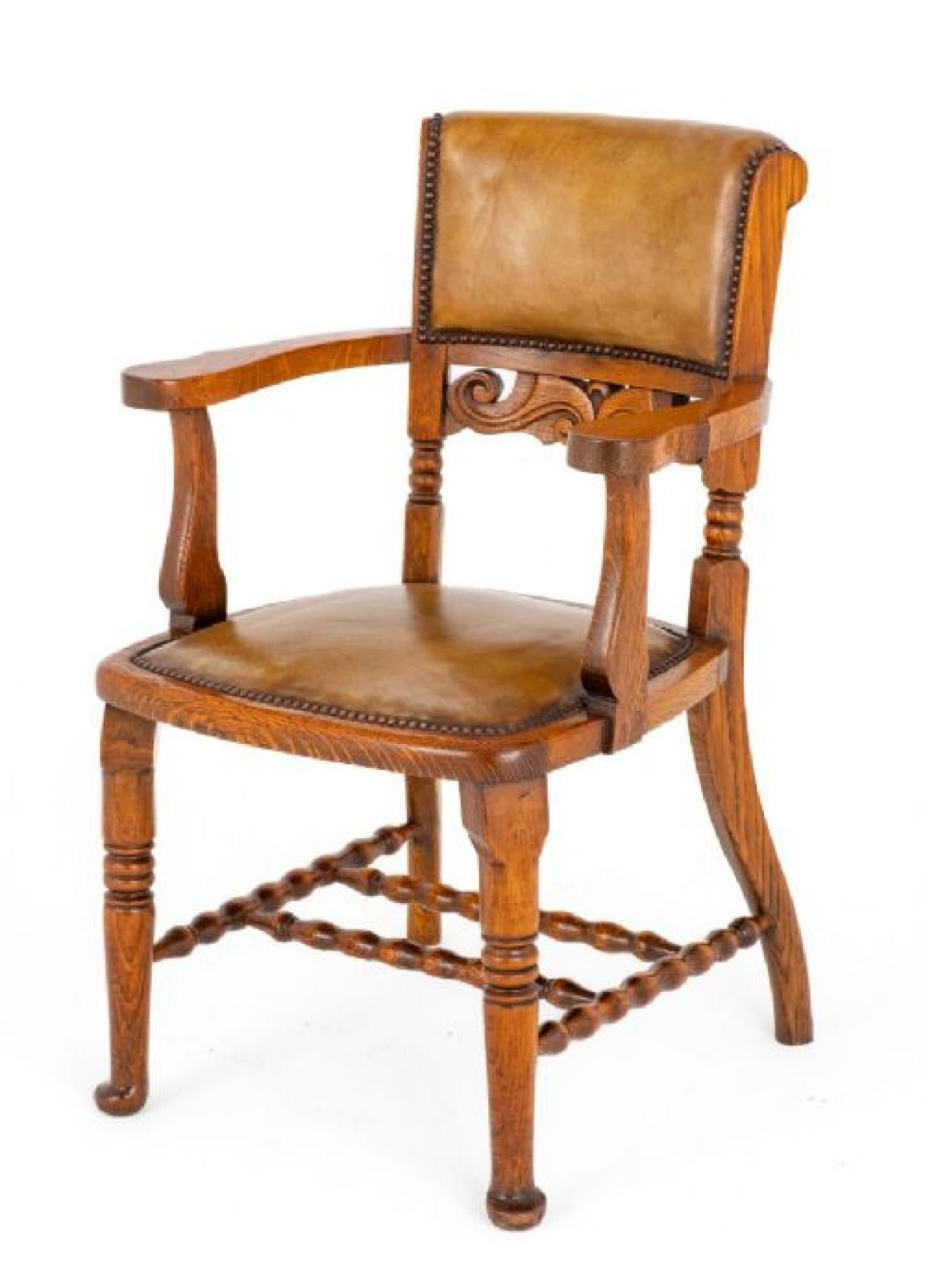 Victorian Oak and Leather Desk Chair. 
Please scroll through for more pix - this ships anywhere, please get in touch
Circa 1870
This Chair is Raised Upon Ring Turned Front Legs and Shaped Back Legs. 
The Chair Features a Bobbin Turned Stretcher.