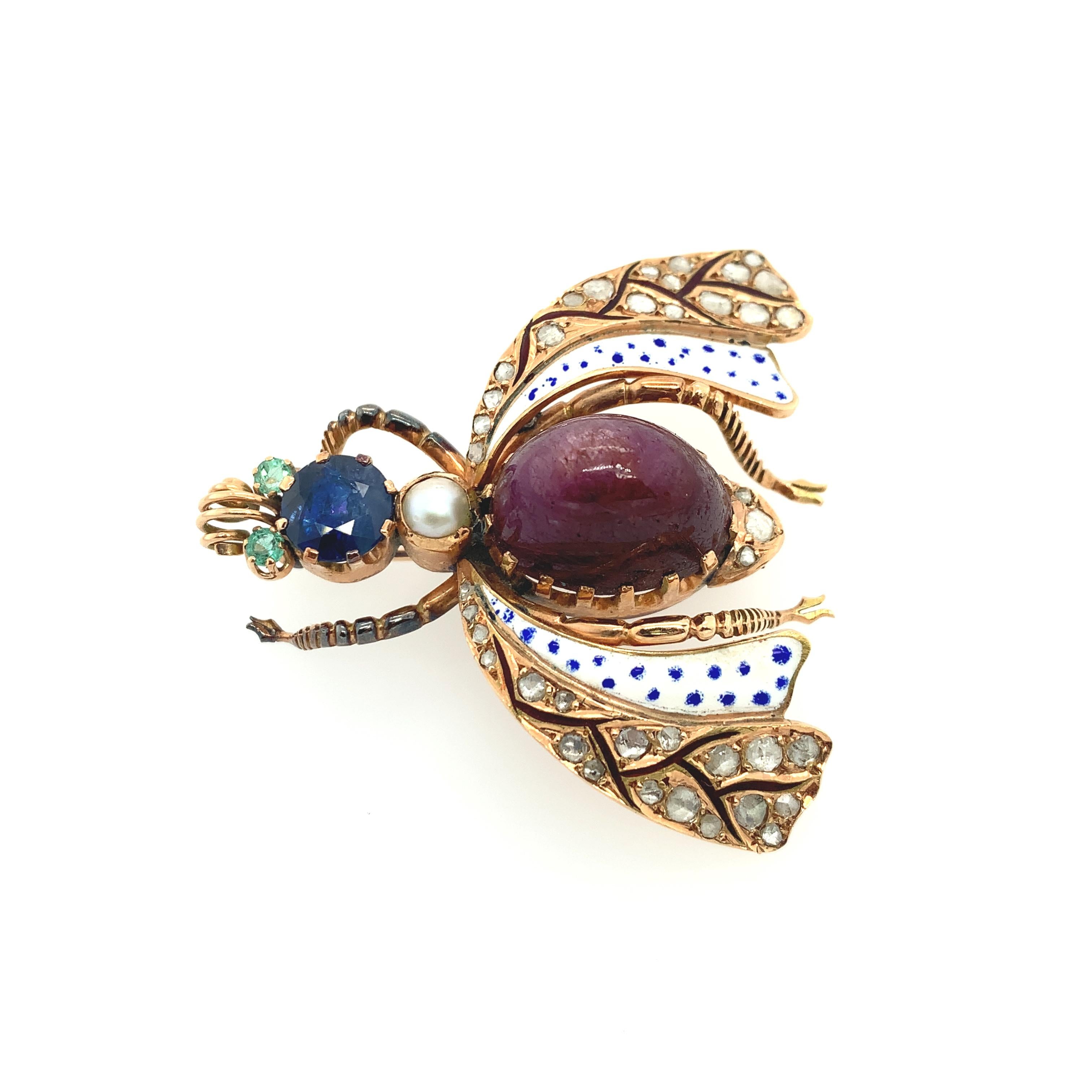 An impressive hand-made Victorian insect brooch in 14K rose gold, embellished with (39) thirty-nine old rose cut diamonds. At its center, the insect features bead set diamonds with emerald eyes, a sapphire head, and decorated with a pearl and star