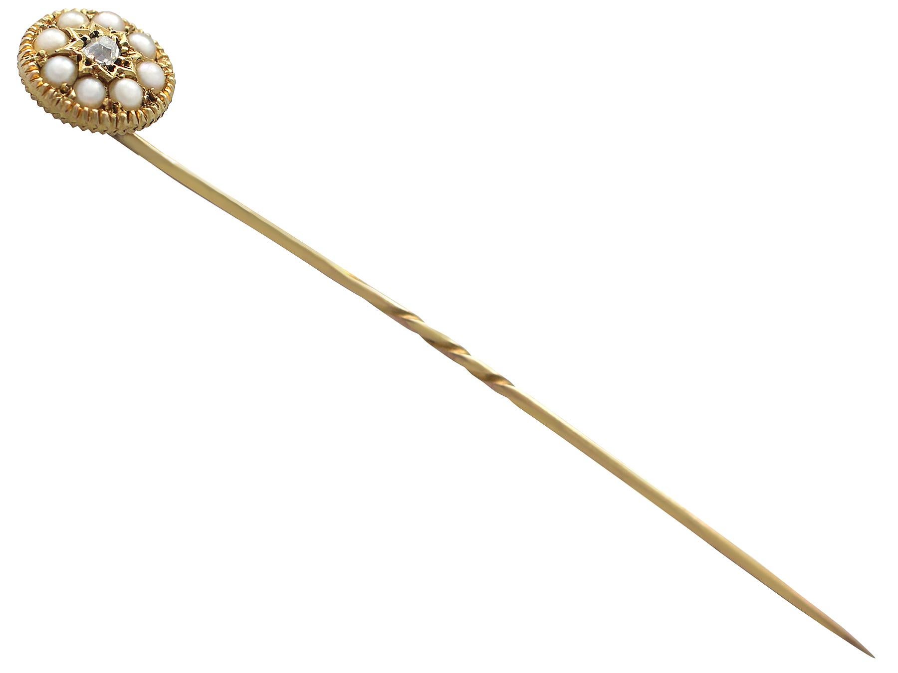 An antique Victorian 0.04 carat diamond and seed pearl, 14 karat yellow gold and base metal pin brooch; part of our antique jewelry and estate jewelry collections

This fine diamond brooch has been crafted in 14k yellow gold with a base metal