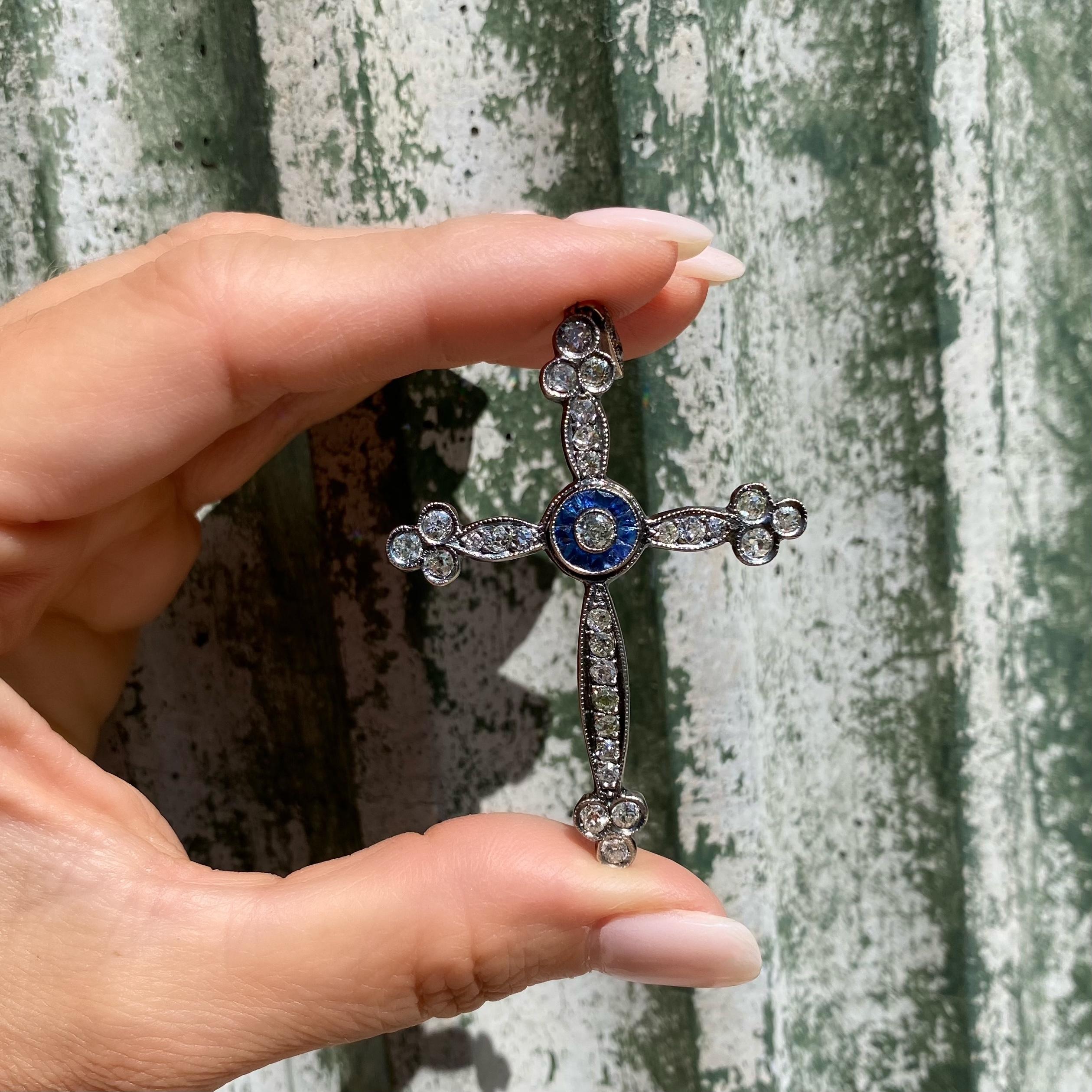 Beautiful Ornate and Finely detailed Antique Victorian Cross, Hand set with 32 old Mine and old European cut Diamonds, weighing approx. 3.15tcw with French cut Sapphires approx. 0.85tcw in center. Hand crafted in Silver on 9K Karat white Gold. The