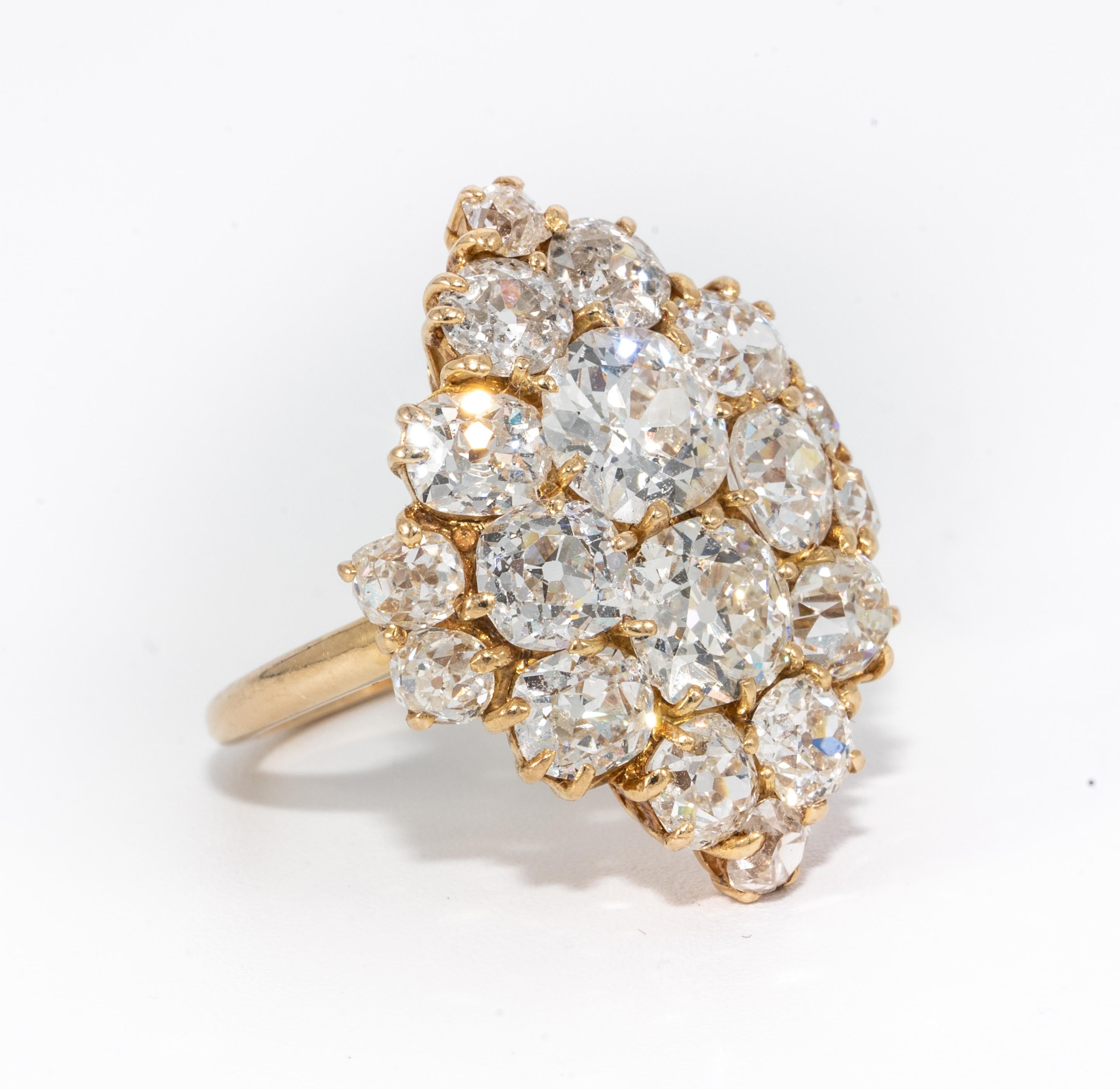 Antique Victorian Diamond Cluster Ring with Old Mine Cuts 
18 Old Mine Diamonds weigh Approx 6.48 Carats
Breakdown is as follows:: 2 larger diamonds weigh approx  1.04ct, and 1.00 ct, 2 diamonds @ .65ct each , 2 diamonds @ .50ct each, 4 diamonds @