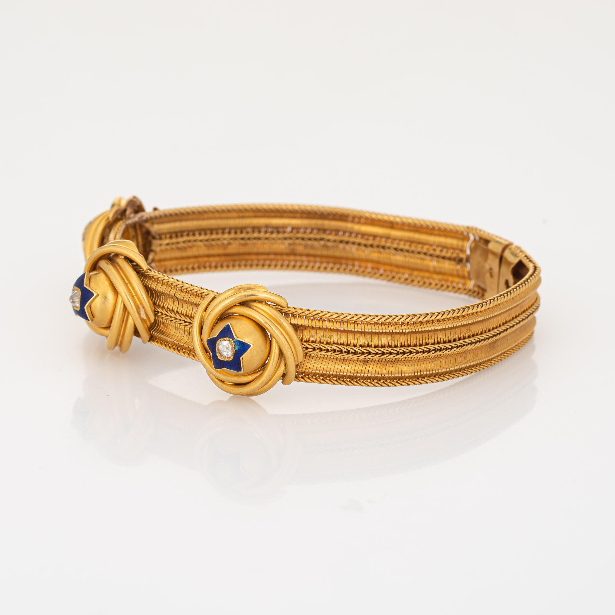 Finely detailed antique Victorian bracelet (circa 1850s) crafted in 14k yellow gold. 

Three old mine cut diamonds are estimated at 0.10 carats each and total an estimated 0.30 carats (estimated at I-J color and I1 clarity).

Three infinity knots to
