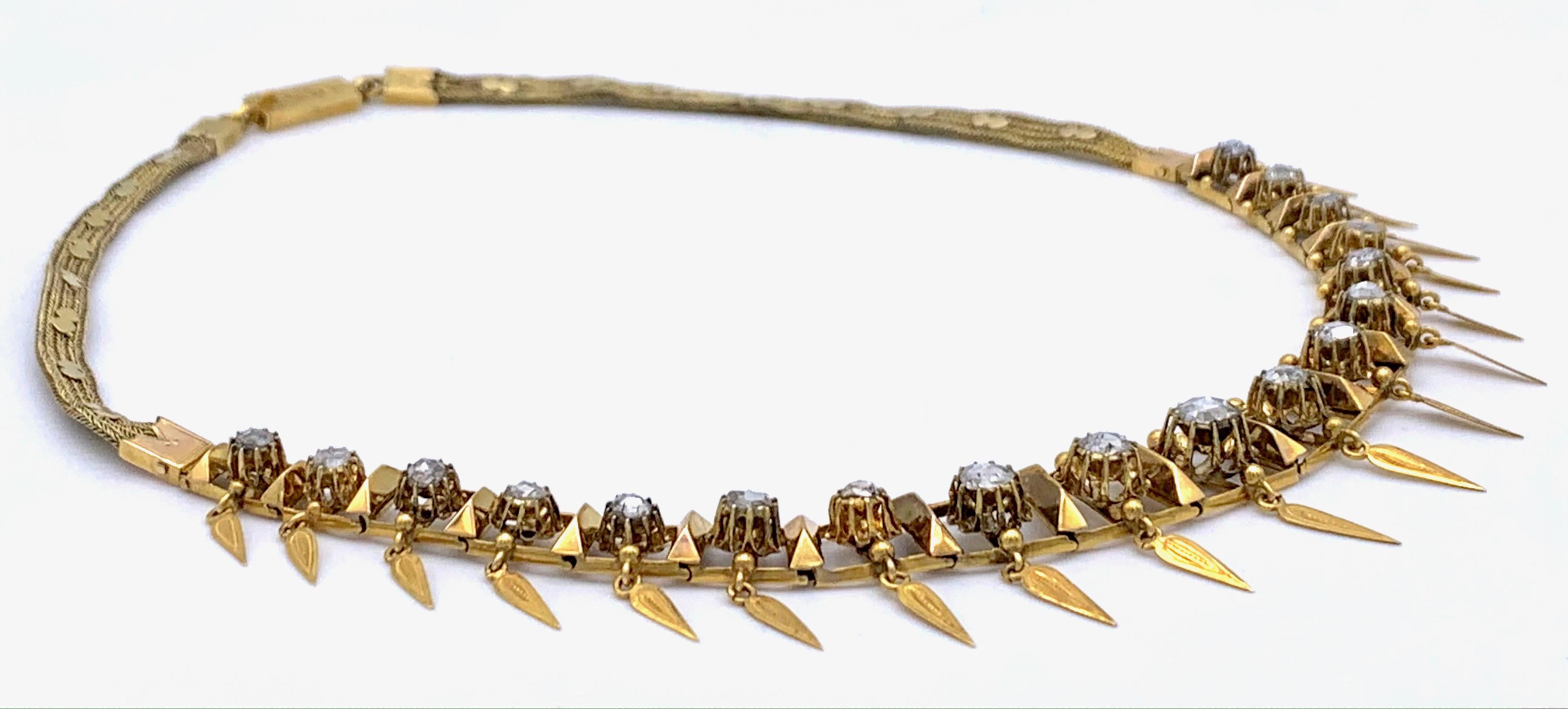 This stylish and unusual necklace is made out of 18 rectangular hinged flexible rose gold segments, decorated each with a claw set rose cut diamand and an engraved gold tassel. Each hinge is covered by a pyramid shaped element.  The rectangular
