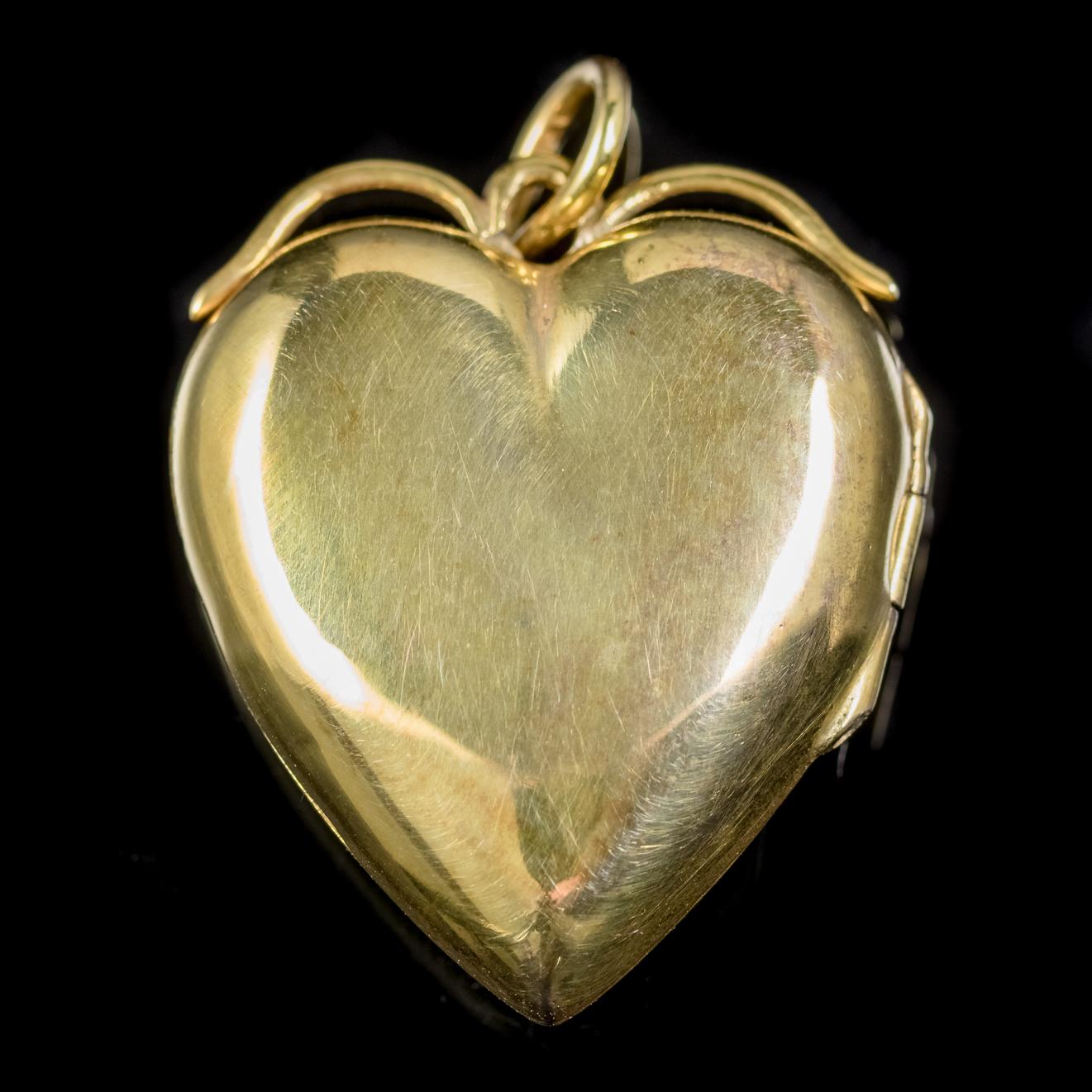 A sweet antique Victorian heart locket C. 1900, set with a lovely 0.10ct natural Opal in the centre surrounded by six sparkling Diamonds, approx. 0.12ct in total. 

The lovely natural Opal is a kaleidoscope of rainbow colours shimmering and changing