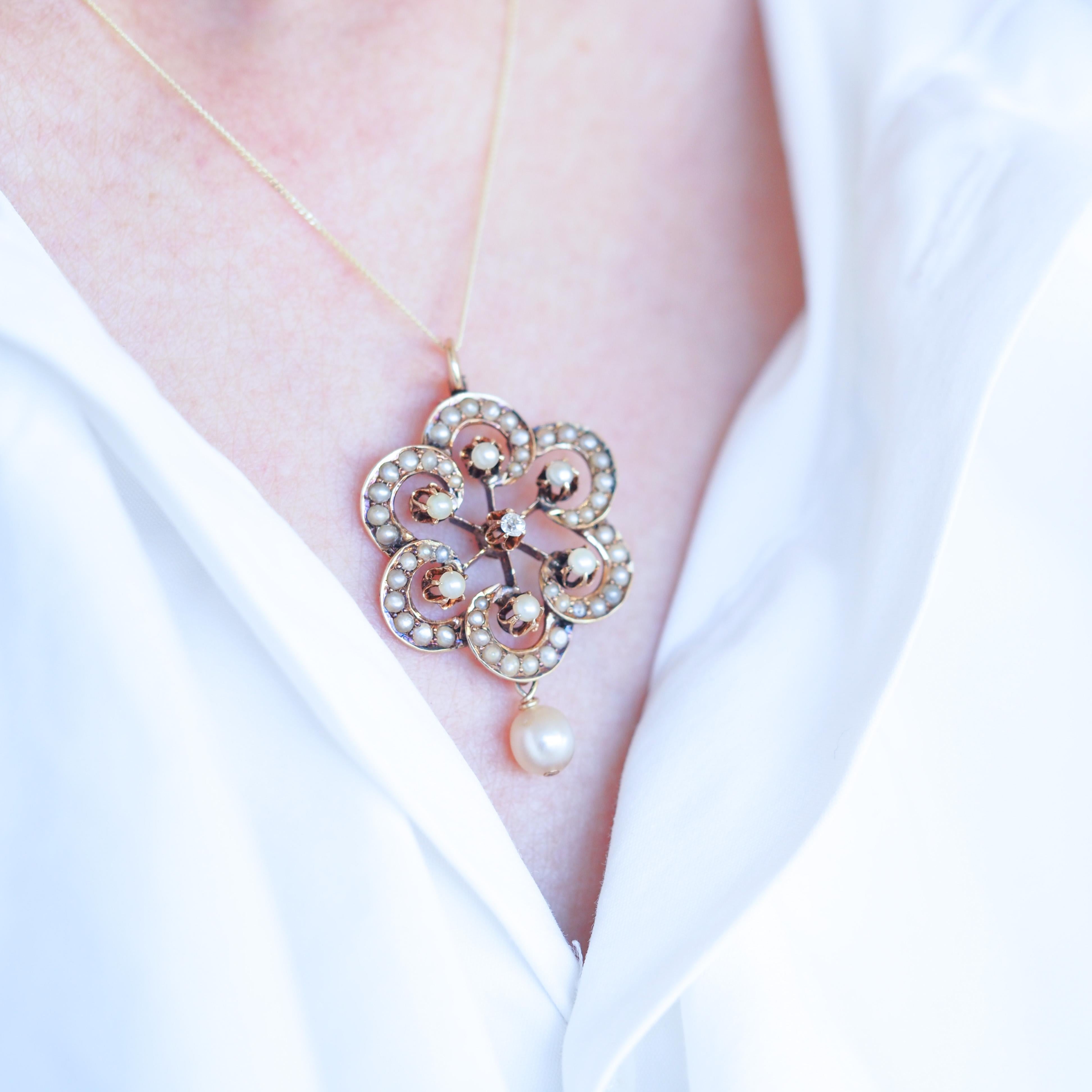 We are delighted to offer this lovely antique Victorian 14ct gold diamond and pearl necklace made c.1900

This pendant features such a lovely & regal design with an almost flower like shape, each petal finely curved and mounted intricately with fine
