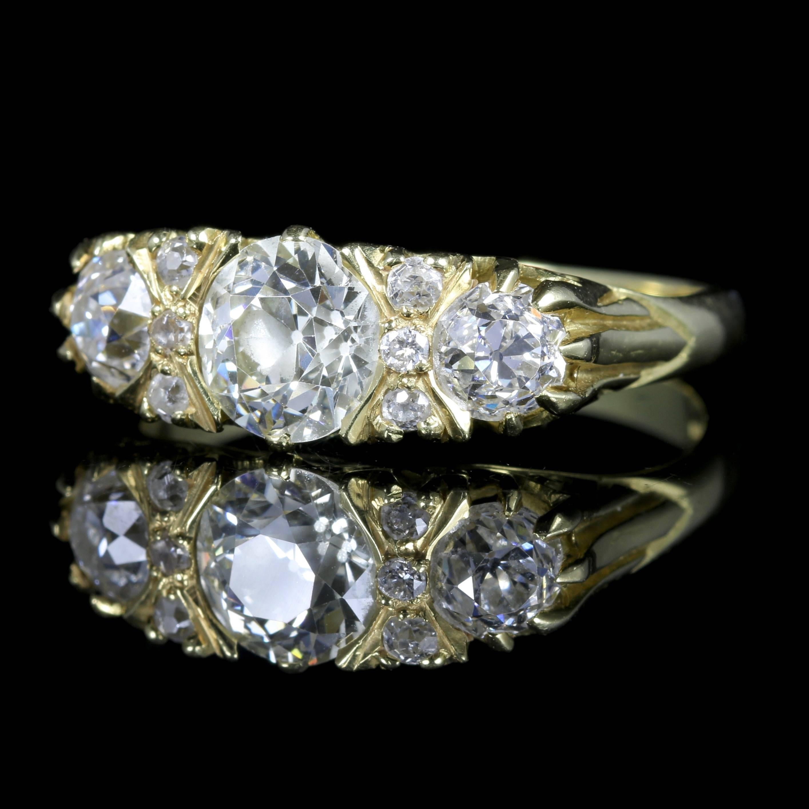 For more details please click continue reading down below...

This fabulous 18ct Yellow Gold antique Victorian Diamond ring is Circa 1880.

This spectacular carved ring boasts three large old cut bright white Diamonds which are VS1 H colour, and