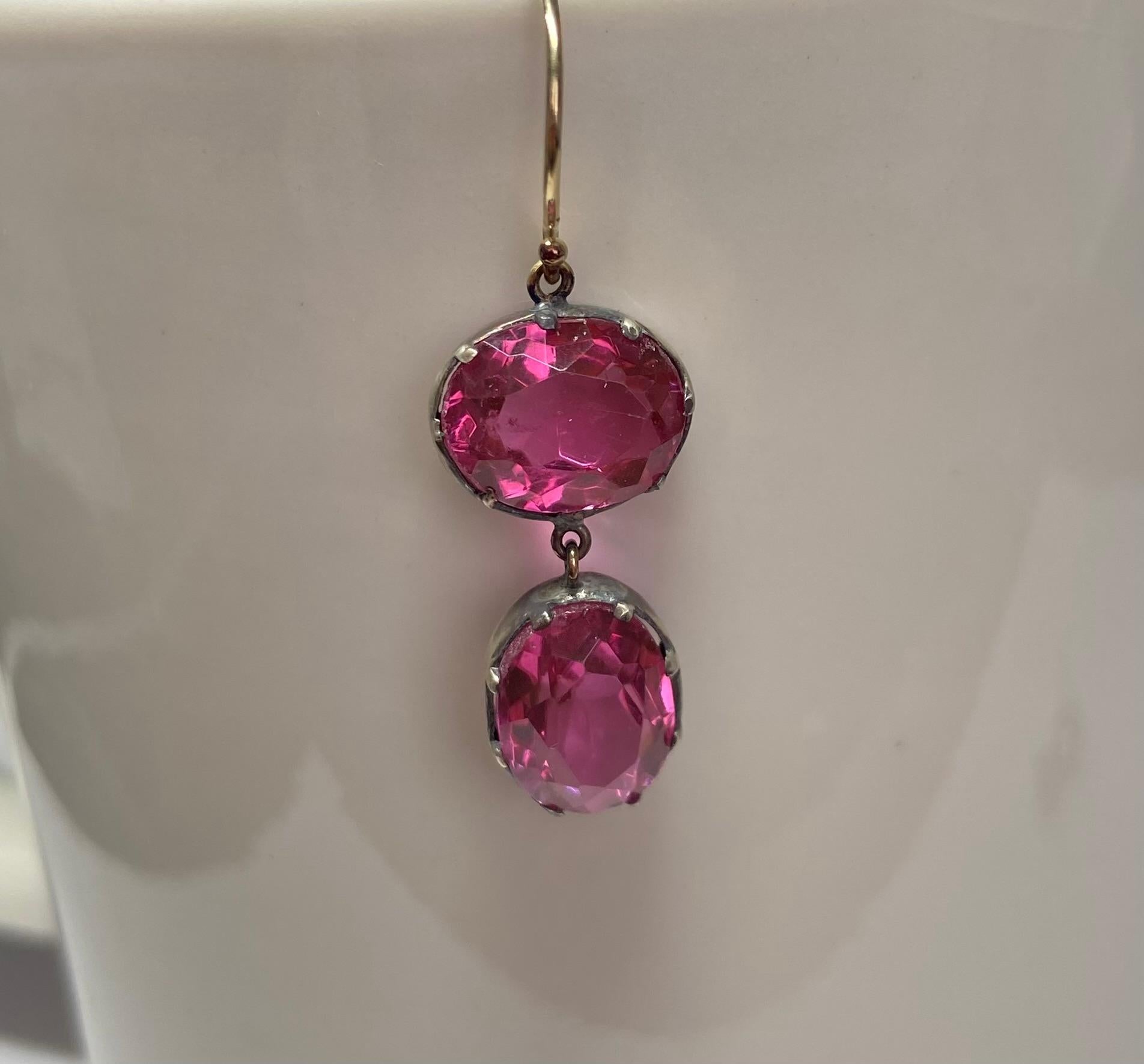 Cotton Candy is the color of this pair of Victorian pink paste earrings, the color that is a favorite of paste lovers. Not one paste but two comprise each earring, one stone being a horizonal oval and one vertical. Paste jewelry was an art form in