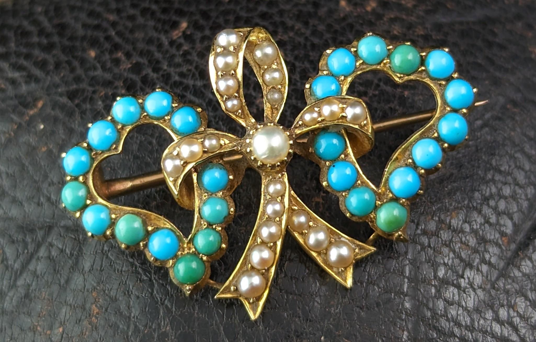 You can't help but be bewitched by this fine antique Victorian 'witches' heart brooch.

This gorgeous piece features double witches style hearts in rich 22ct yellow gold, each heart is adorned with lush vibrant turquoise cabochons in various