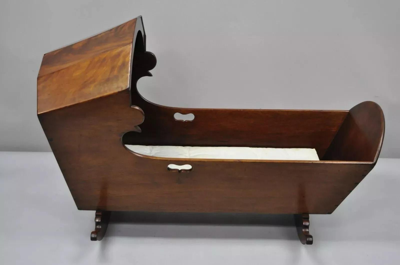 Antique Victorian Dovetailed Crotch Mahogany Wooden Hooded Baby Cradle. Circa Late 19th Century. Measurements: 31