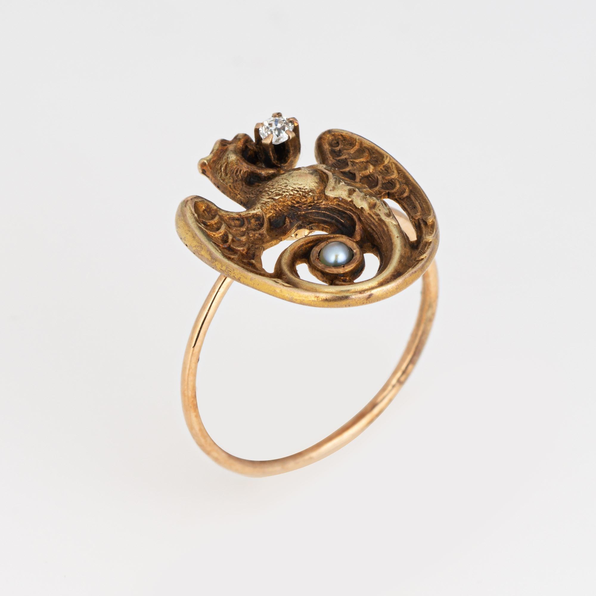 Originally an antique Victorian era stick pin (circa 1880s to 1900s), the Dragon ring is crafted in 14 karat yellow gold.

The ring is mounted with the original stick pin. Our jeweler rounded the stick pin into a slim band for the finger. The