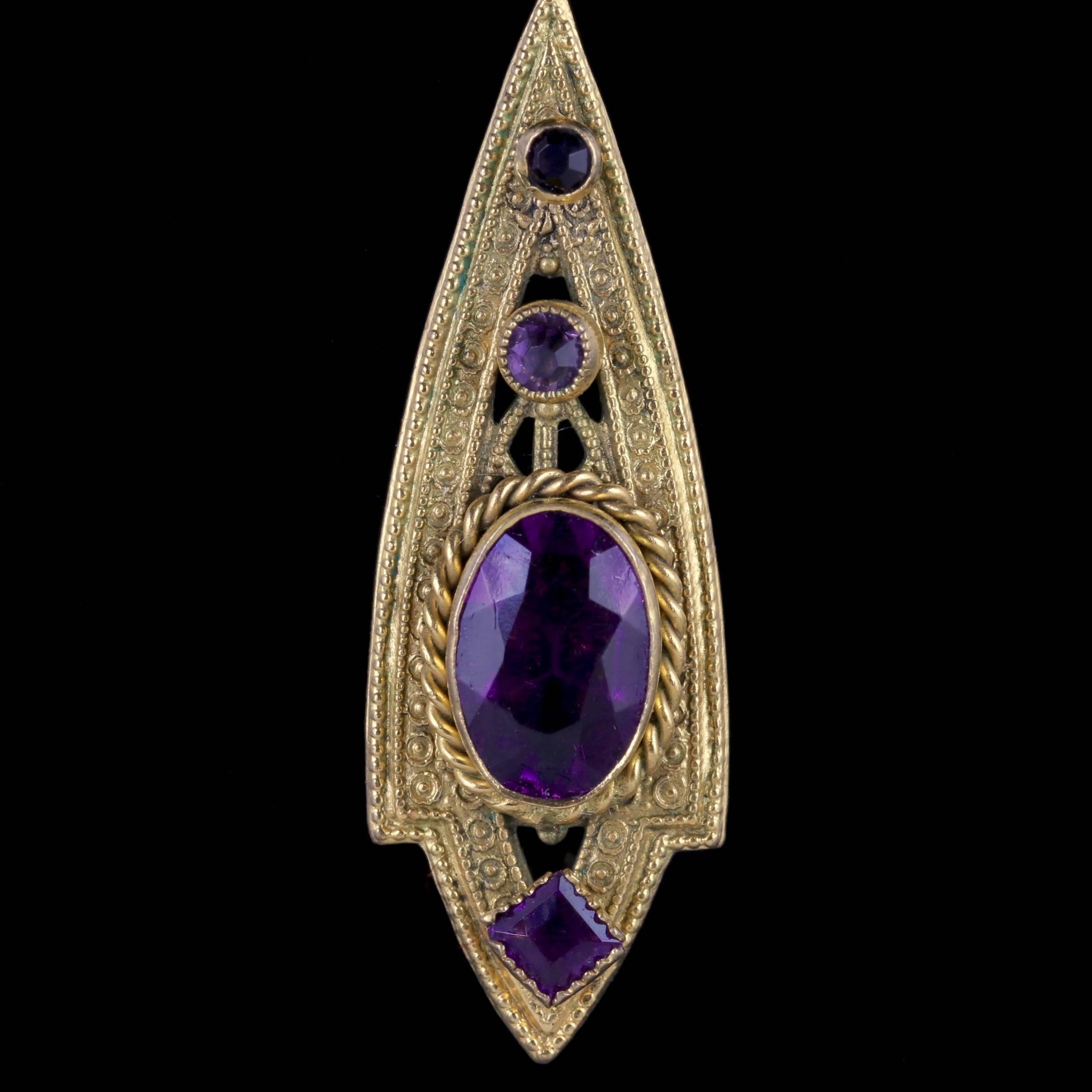 To read more please click continue reading below-

These stunning antique Gold gilt drop earrings are Victorian Circa 1900. 

Each earring is adorned with fabulous purple Paste Stones in a beautifully engraved Victorian drop gallery. 

Paste is a
