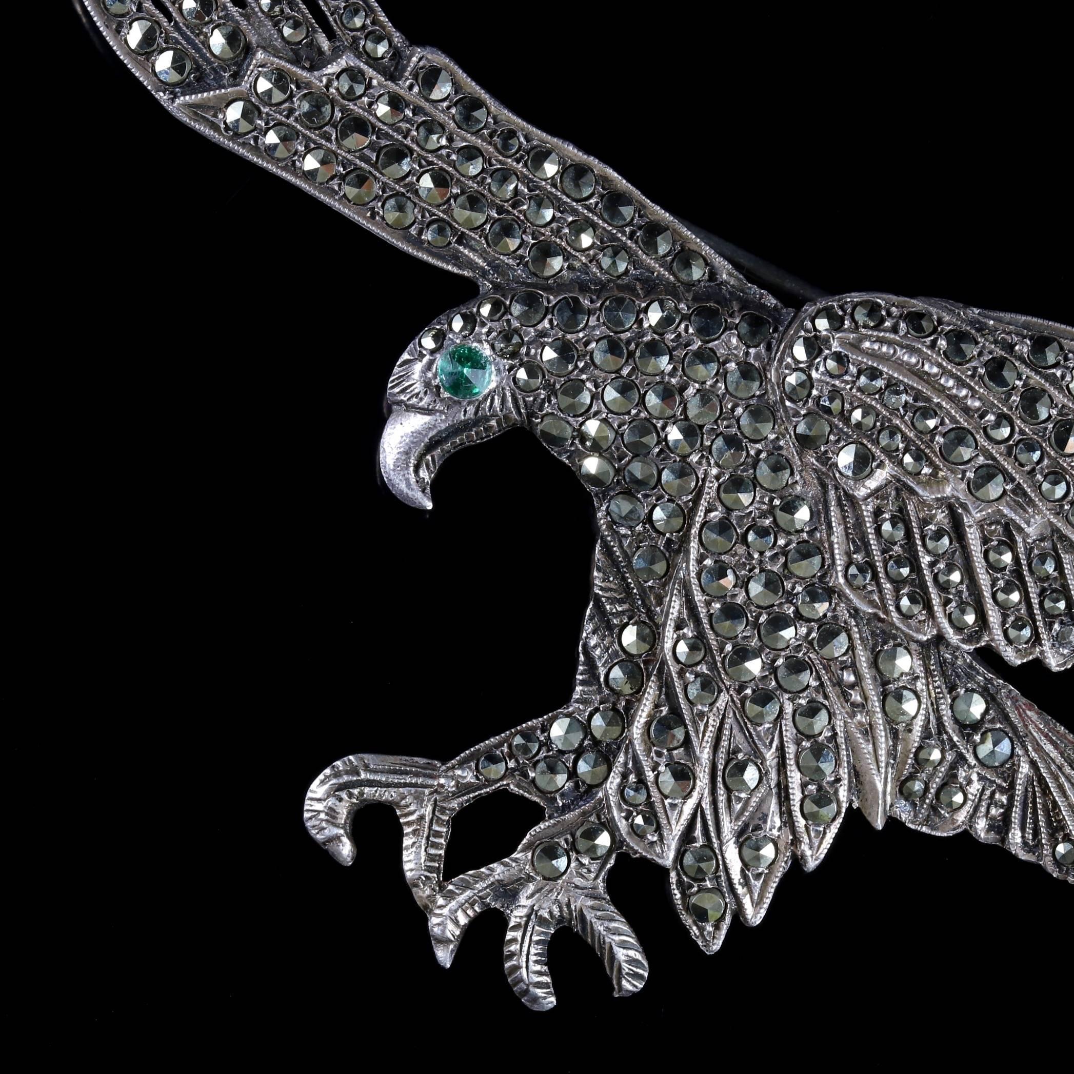 This beautiful large antique Silver Victorian Eagle brooch is Circa 1900. 

The Eagles depicted wings are outstretched and decorated in sparkling Cut Steel studs with a green Paste eye. 

Cut-steel jewellery is set with faceted and polished steel