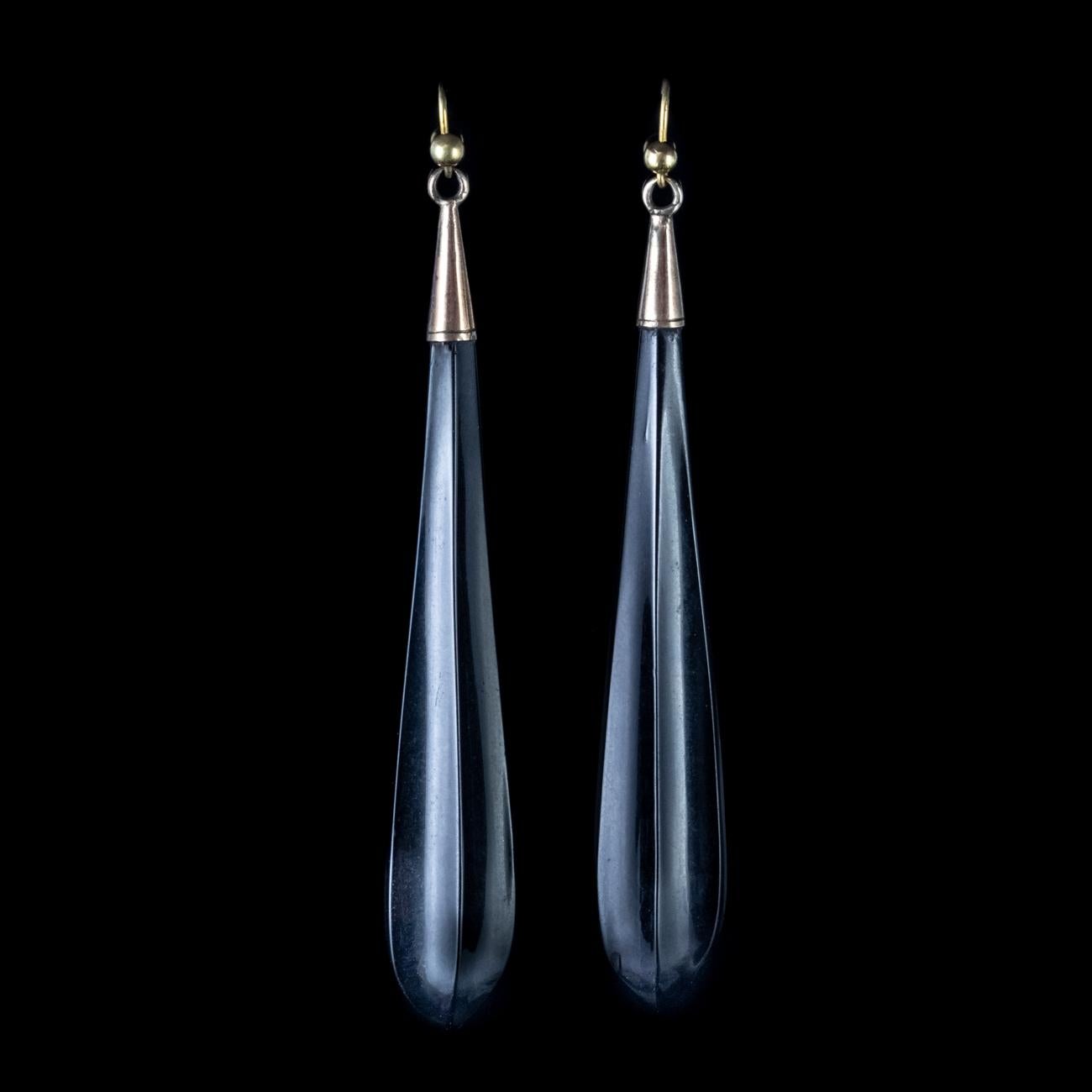 These gorgeous Antique Victorian long drop earrings have been crafted out of stunning black Whitby Jet and fitted with lovely 9ct wire hooks.

Whitby Jet was brought to the attention of the world by Queen Victoria who used Whitby Jet as part of her