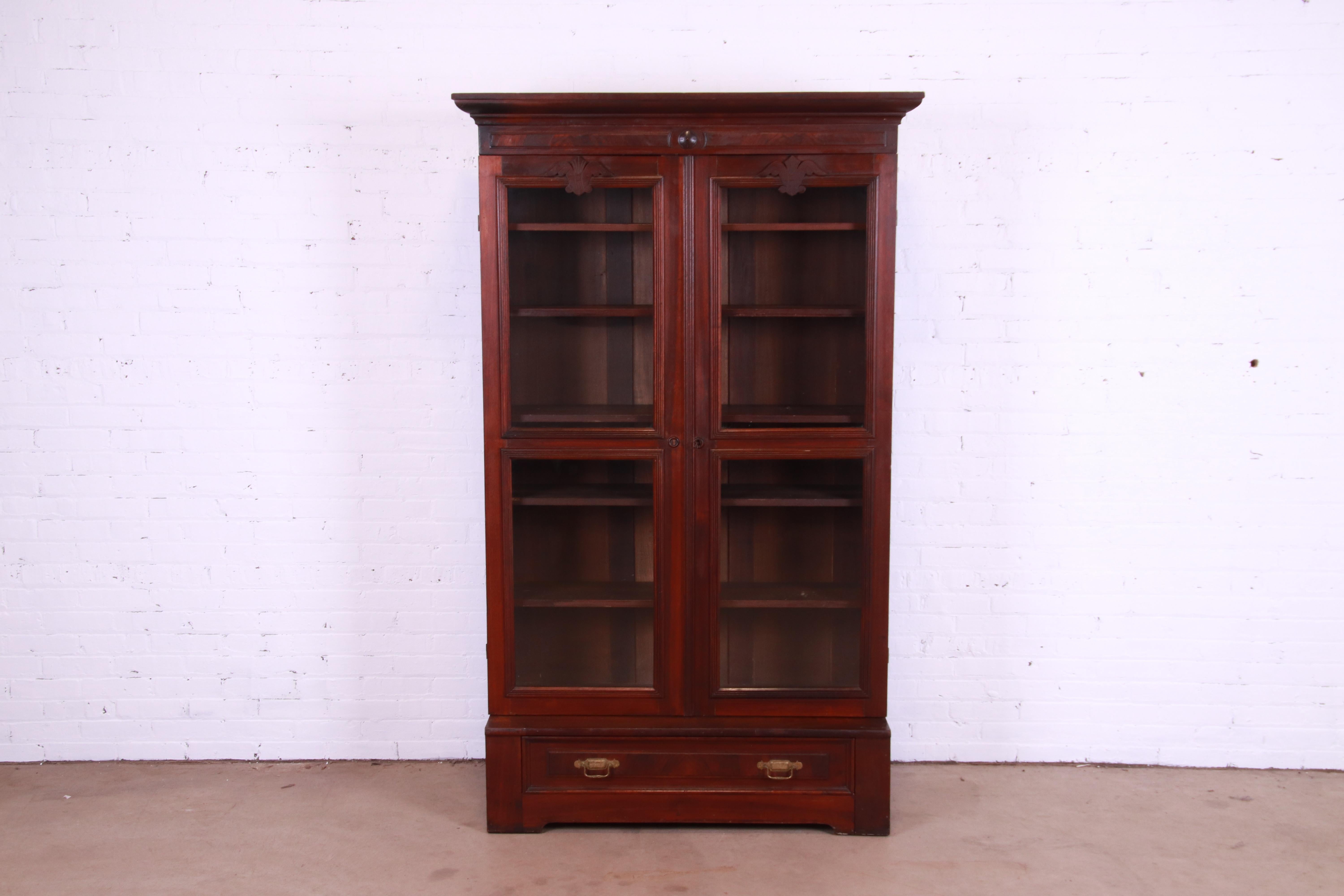 American Antique Victorian Eastlake Carved Walnut and Burl Wood Bookcase, circa 1880s