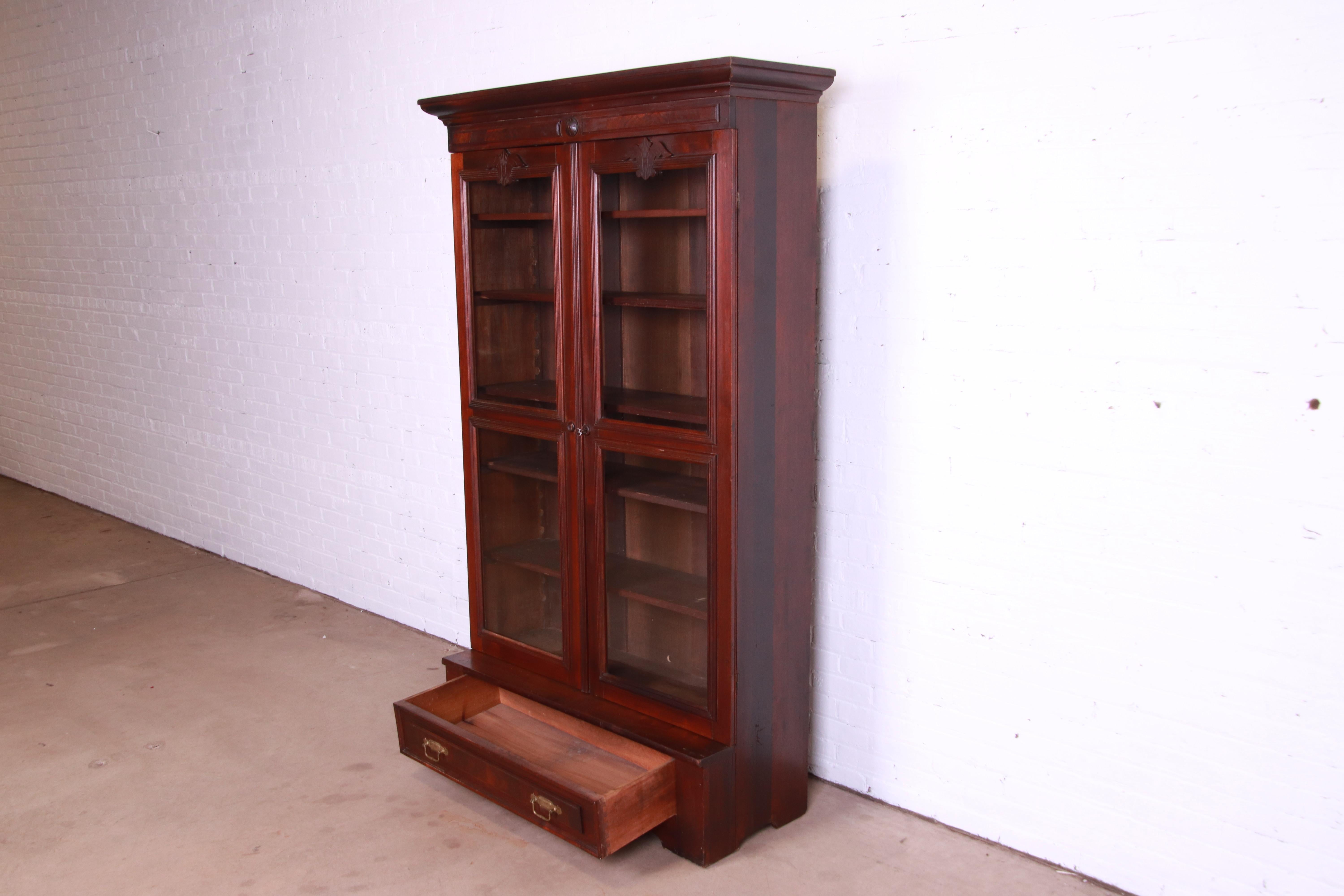 Brass Antique Victorian Eastlake Carved Walnut and Burl Wood Bookcase, circa 1880s