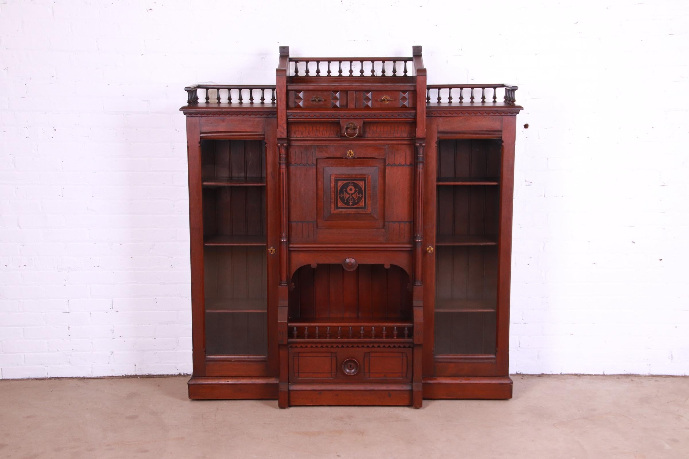 American Antique Victorian Eastlake Carved Walnut Double Bookcase with Secretary Desk