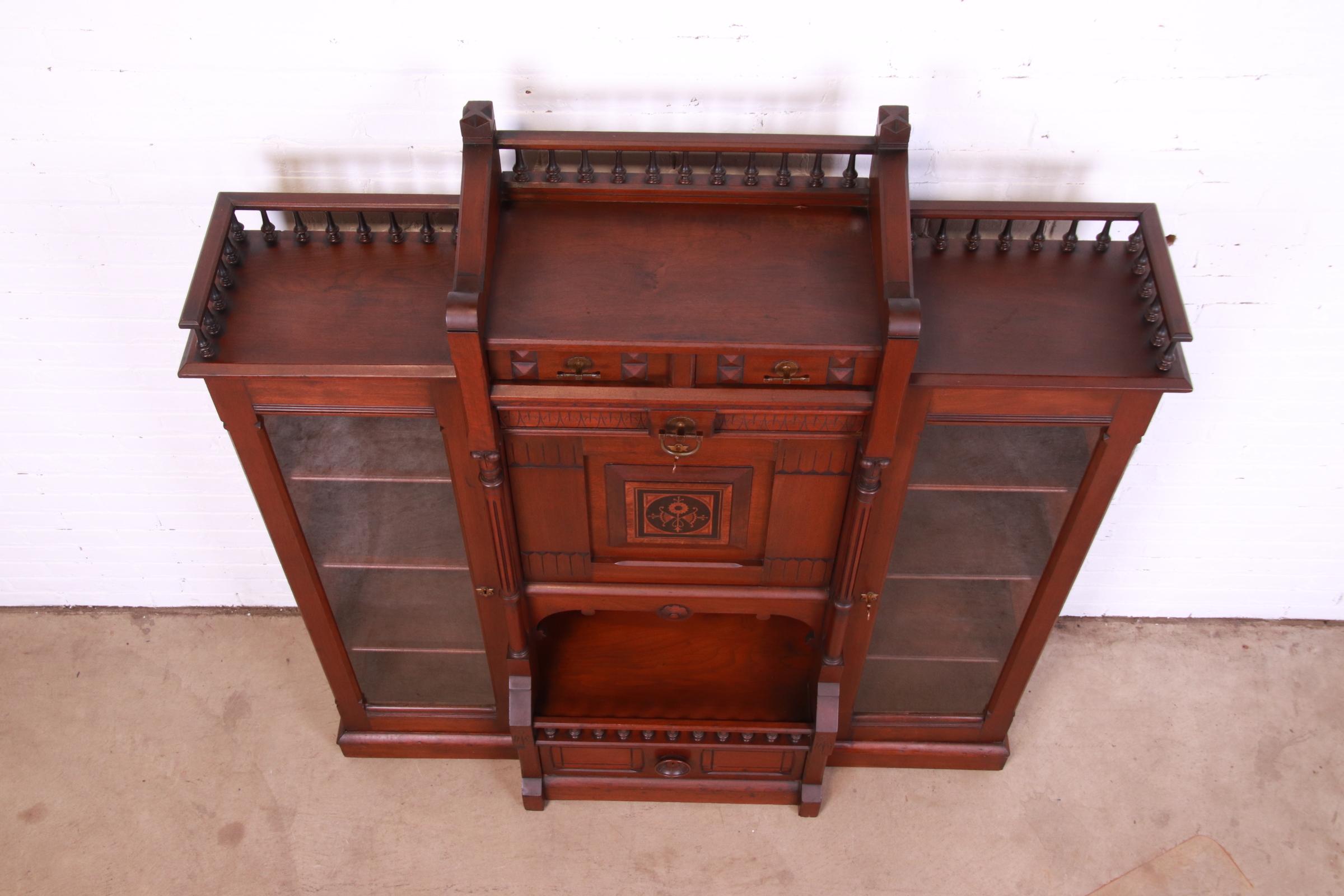 Antique Victorian Eastlake Carved Walnut Double Bookcase with Secretary Desk In Good Condition In South Bend, IN