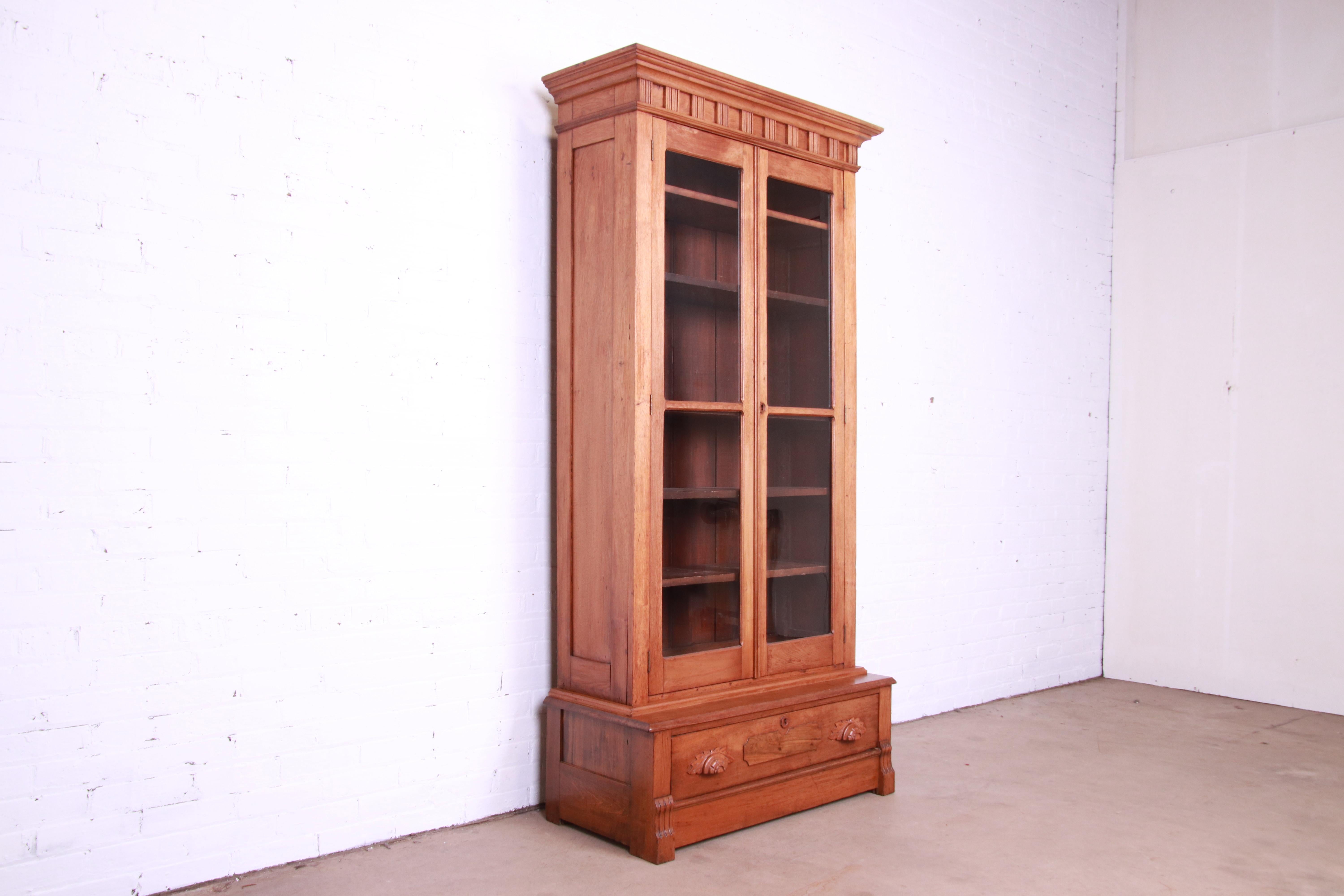 19th Century Antique Victorian Eastlake Carved Walnut Glass Front Bookcase, Circa 1880s