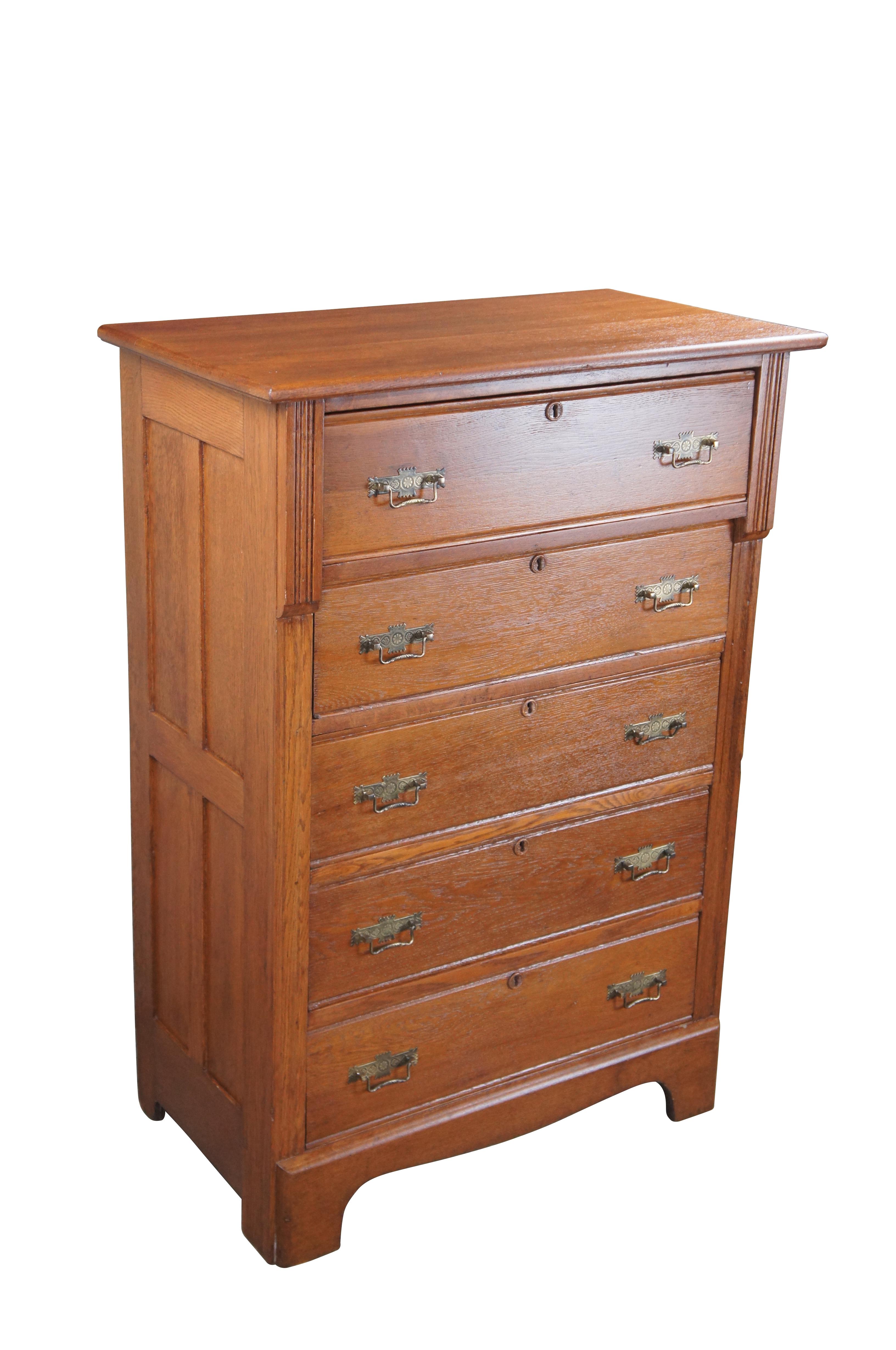 Antique 19th century Victorian tallboy / highboy dresser or chest of drawers by Lewisburg Furniture Company.  Made of oak featuring mission style paneled sides with five drawers, each featuring brass Eastlake hardware.

For nearly 120 years, the