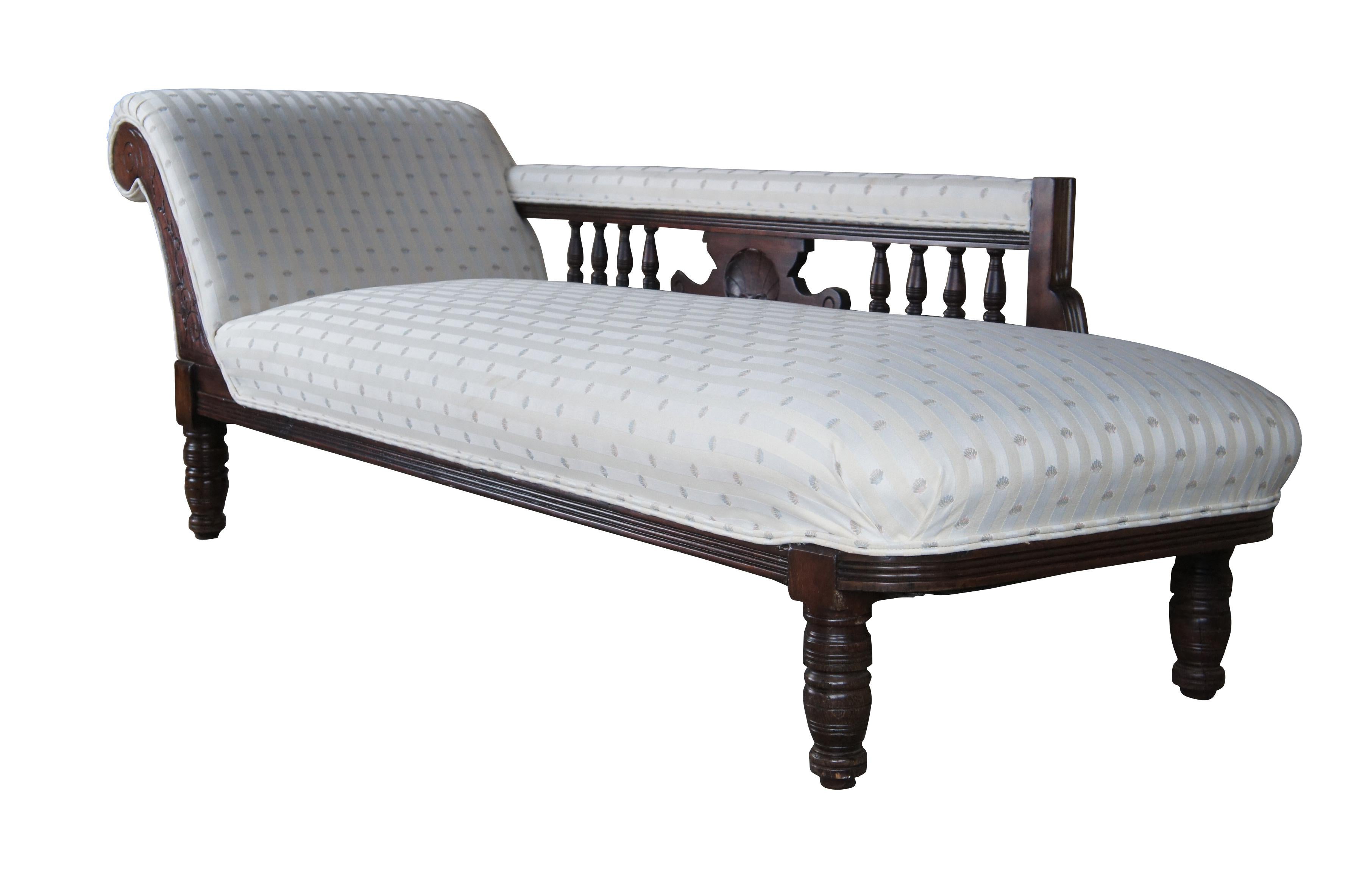 Antique Victorian parlor daybed / chaise lounge / fainting couch / recamier.  Made of mahogany featuring traditional Eastlake styling with a long pierced reticulated arm rest.  A very comfortable and functional antique furnishing.

The Récamier sofa