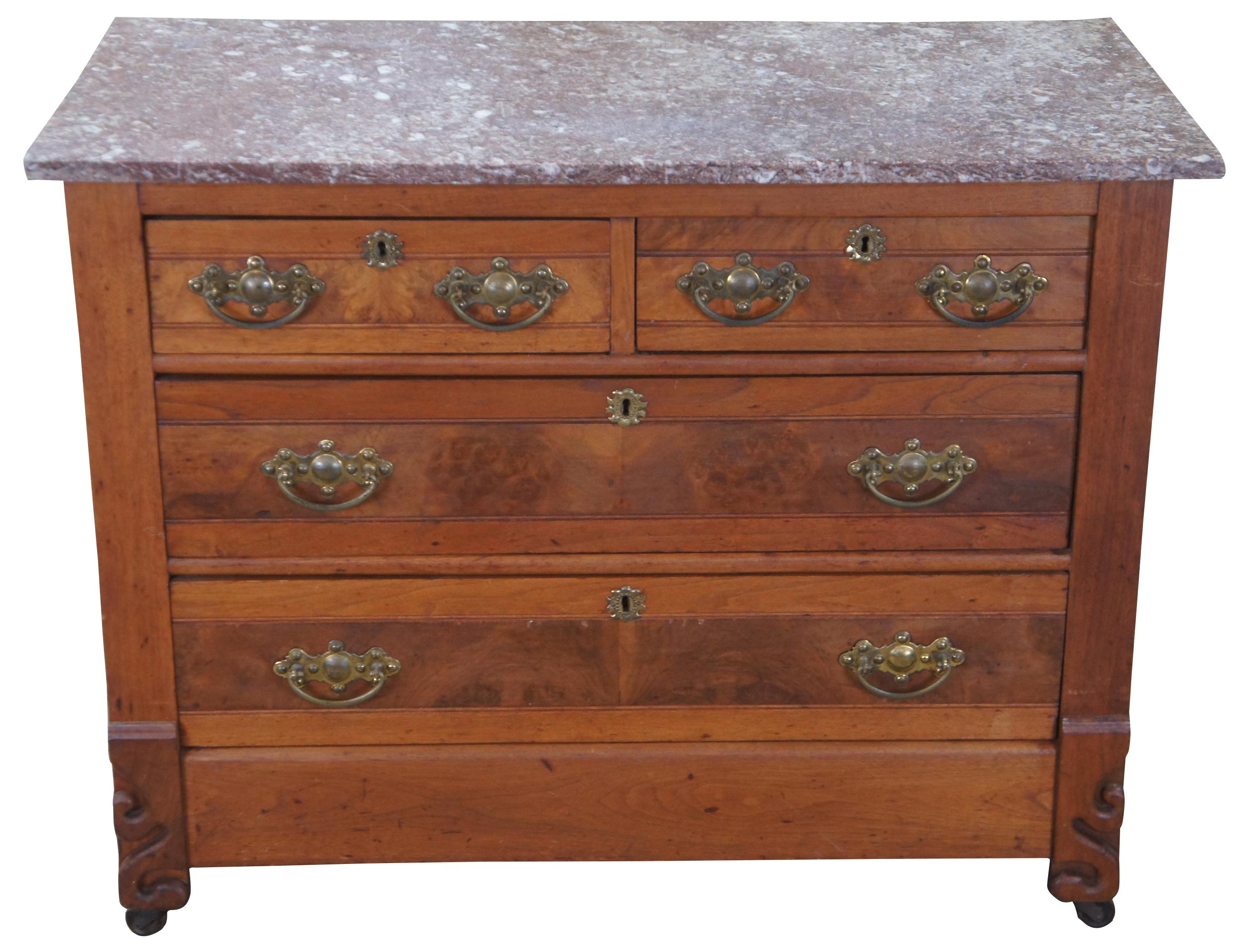 Antique Victorian Eastlake dresser featuring a granite top, four drawers, brass hardware and swivel castors. The drawers are constructed using the Knapp Joint. The Knapp joint was developed during the late Victoria Era in post-Civil War United