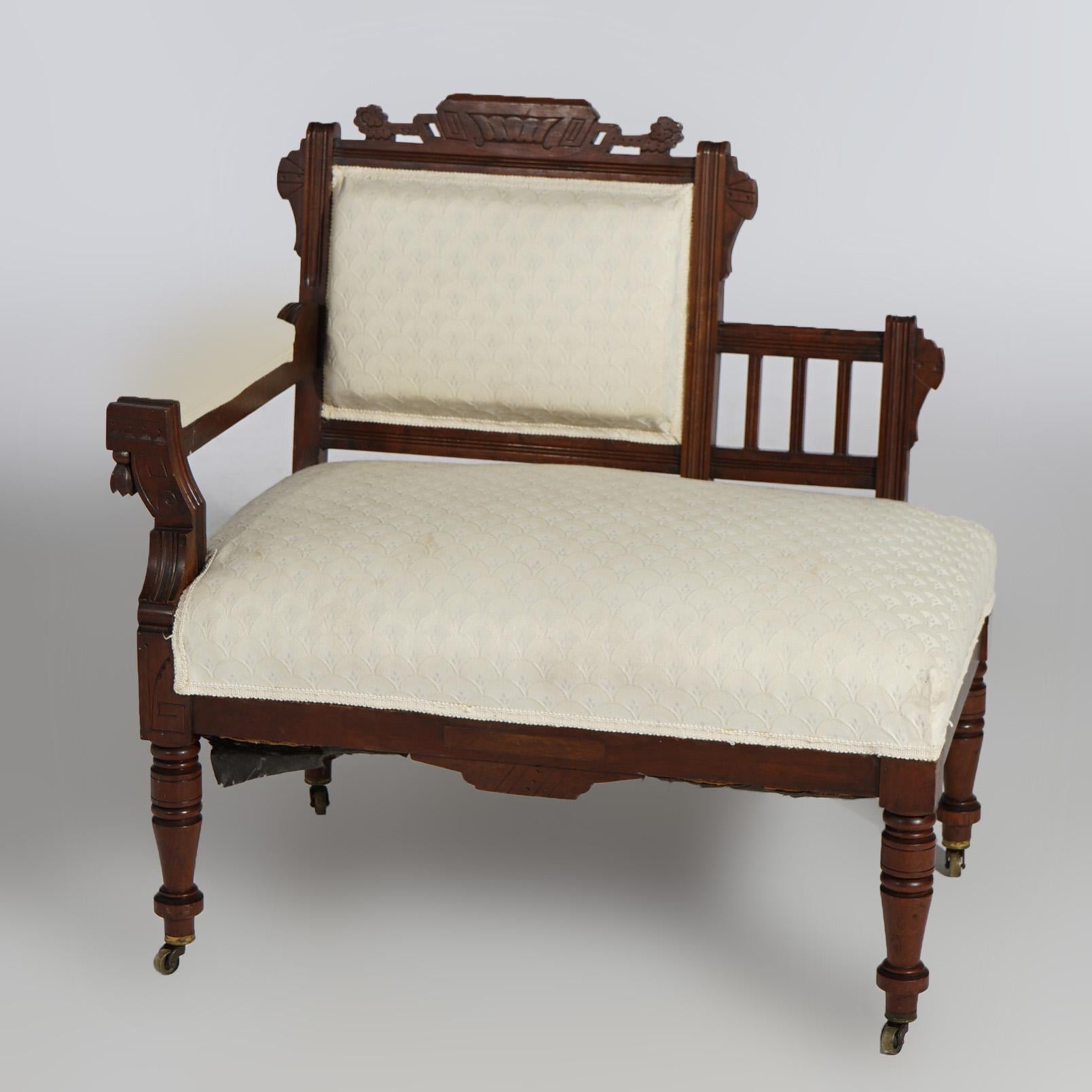 An antique Victorian Eastlake half-settee offers spindle back walnut frame with upholstered seat and back, circa 1890

Measures - 34.5