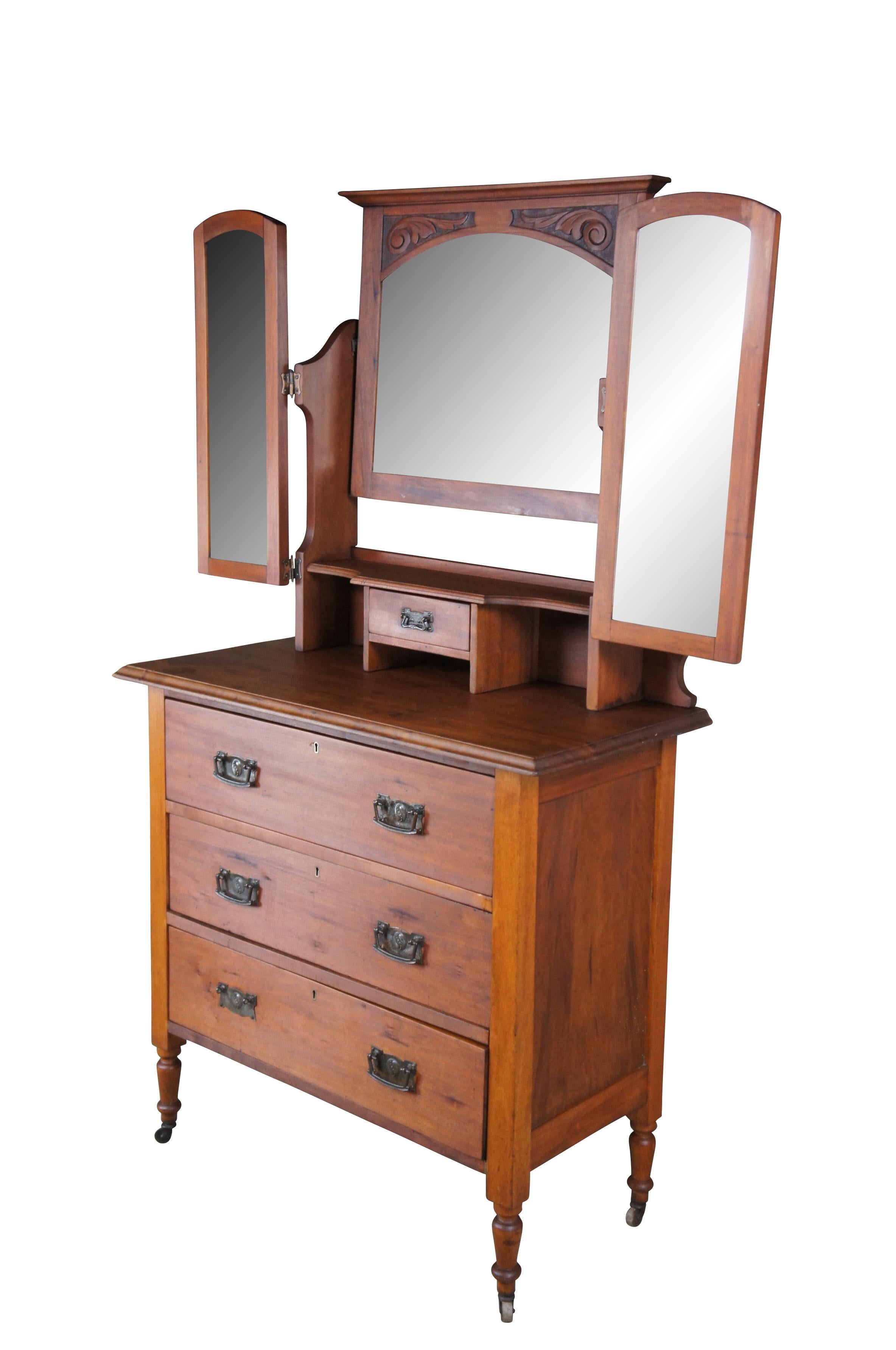 Antique Victorian vanity dresser or shaving stand.  Made of walnut and poplar featuring Eastlake styling with three beveled folding mirrors and four drawers.

Dimensions:
36