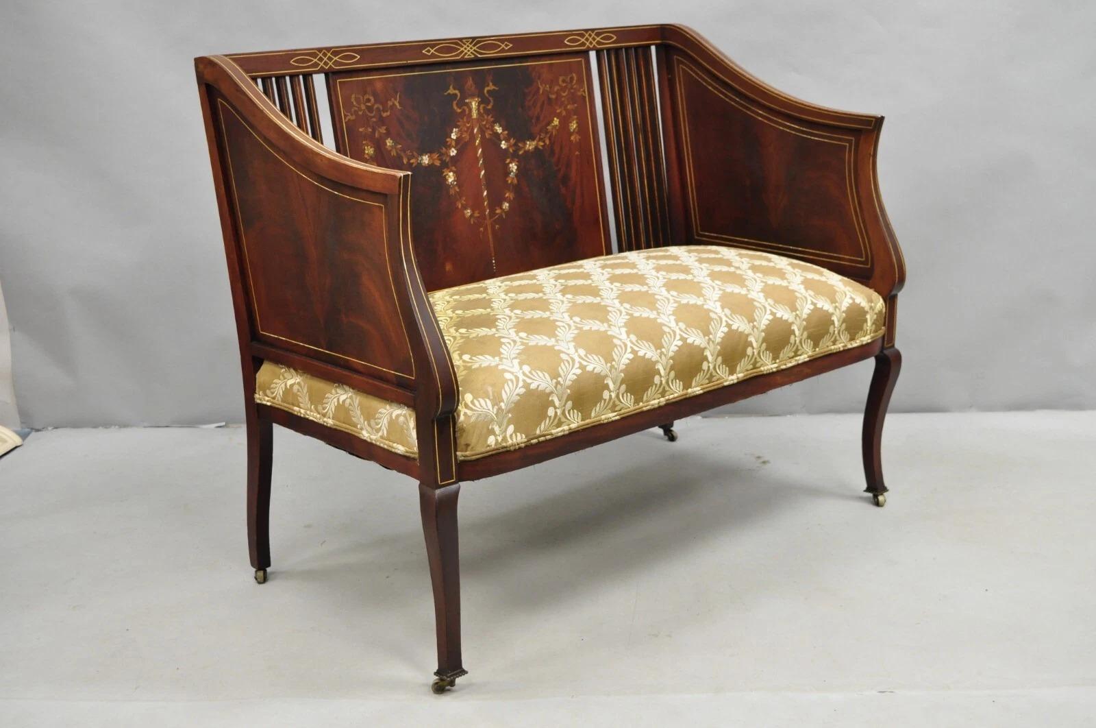 Antique Victorian Edwardian Mahogany Settee Loveseat Sofa with Mother of Pearl Inlay and Rolling Casters. Circa Late 19th Century. Measurements: 33.5
