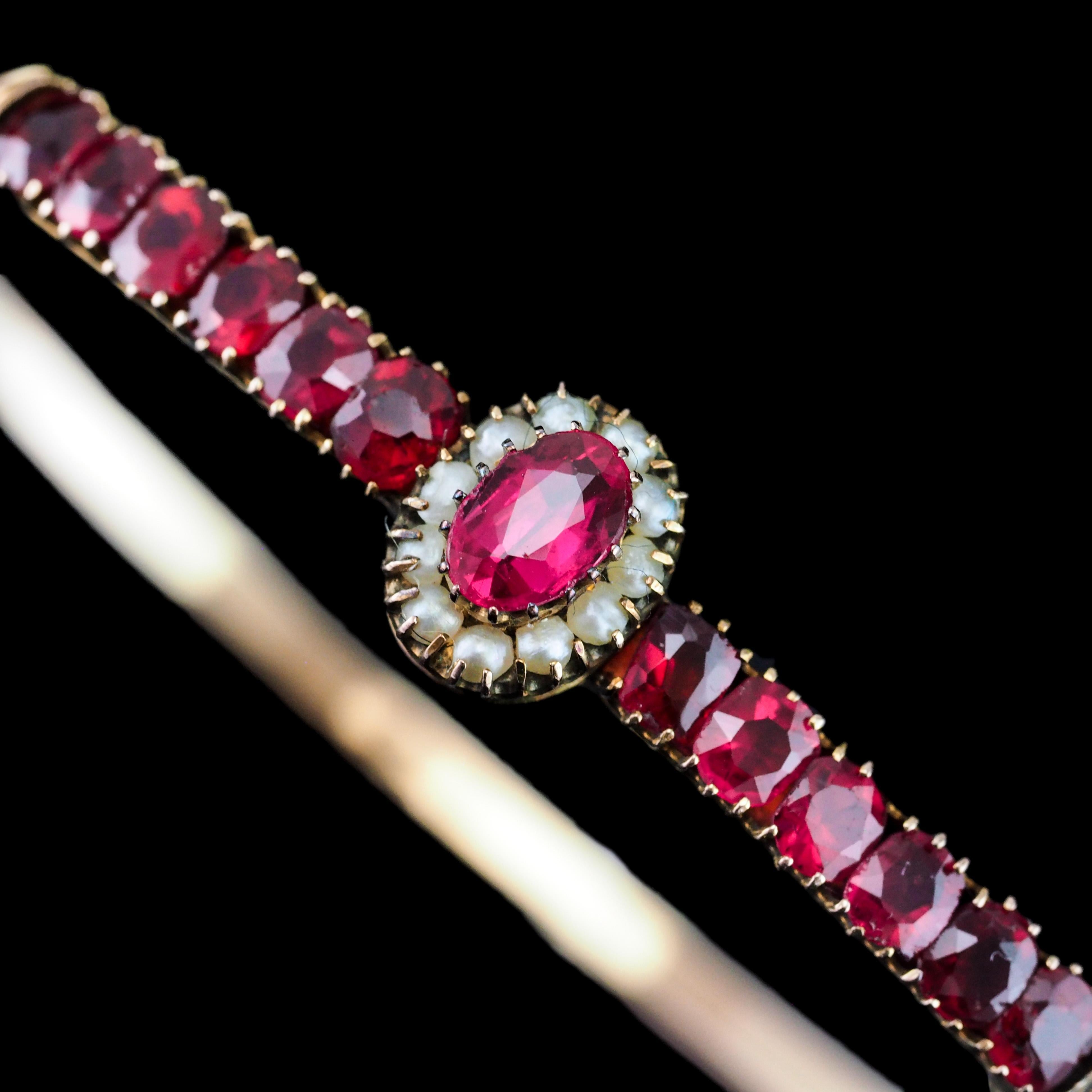 Women's Antique Victorian/Edwardian Pink Garnet & Seed Pearl Bangle 9K Gold - c.1900 For Sale