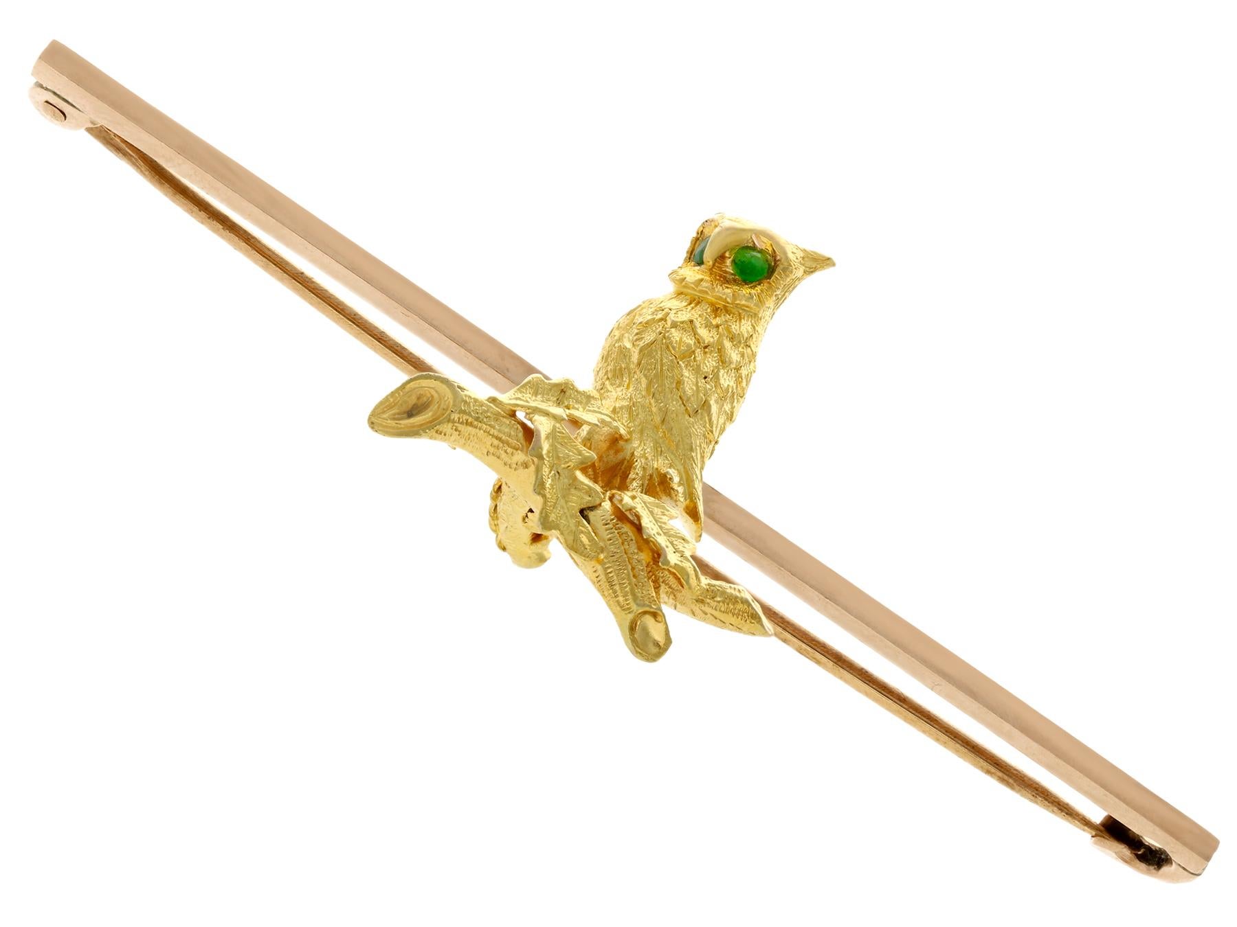 An impressive antique 1890's 0.06 carat emerald and 15 karat yellow gold, 9 karat rose gold and copper 'owl' bar brooch; part of our diverse antique  and estate jewelry collections.

This fine and impressive antique brooch has been crafted in 15k