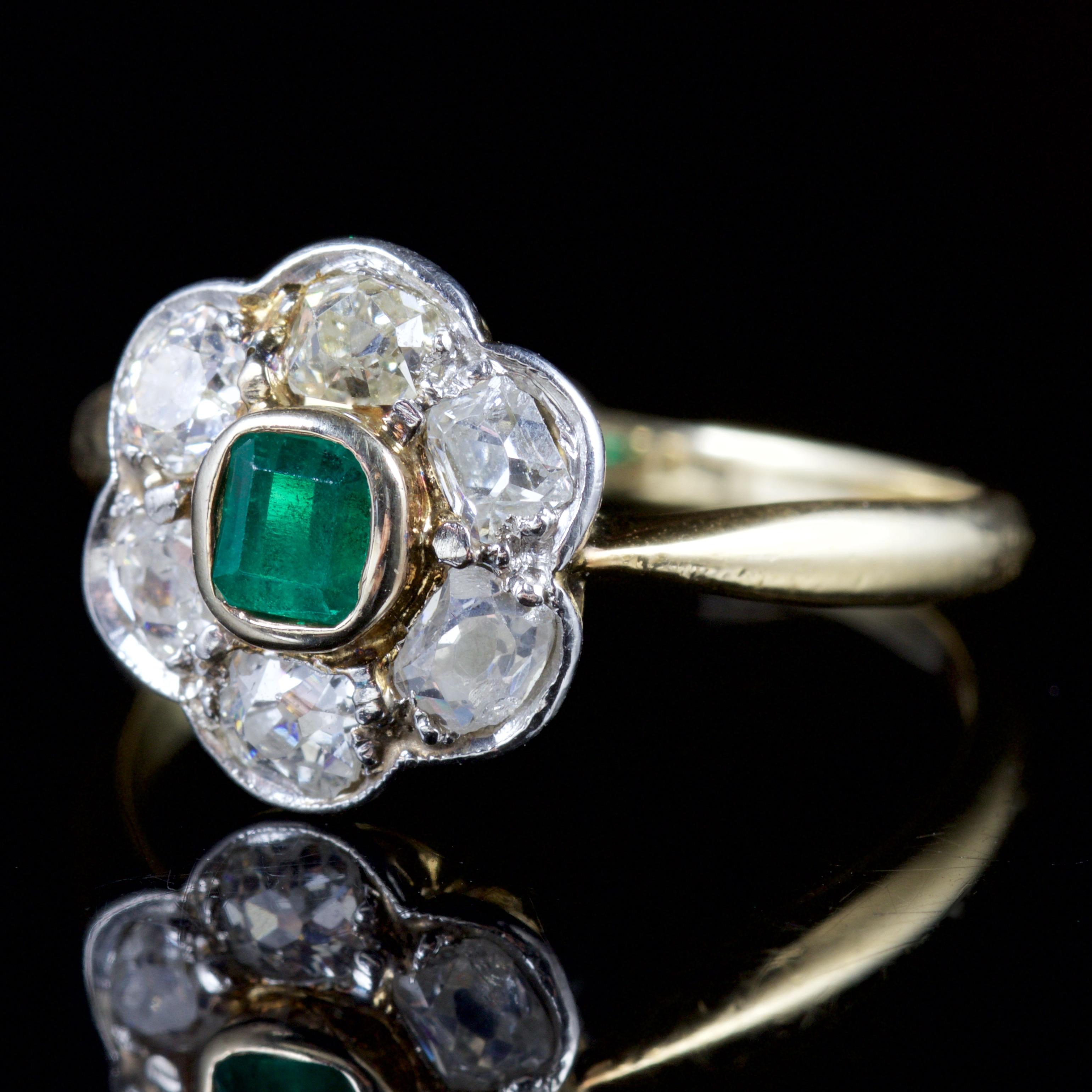 This spectacular Victorian Emerald and Diamond ring is set in 18ct Gold, Circa 1900.

The elegant ring is decorated in a deep, green Emerald which is 0.20ct showing a fabulous hue from within.

The Emerald is surrounded by a glistening halo of