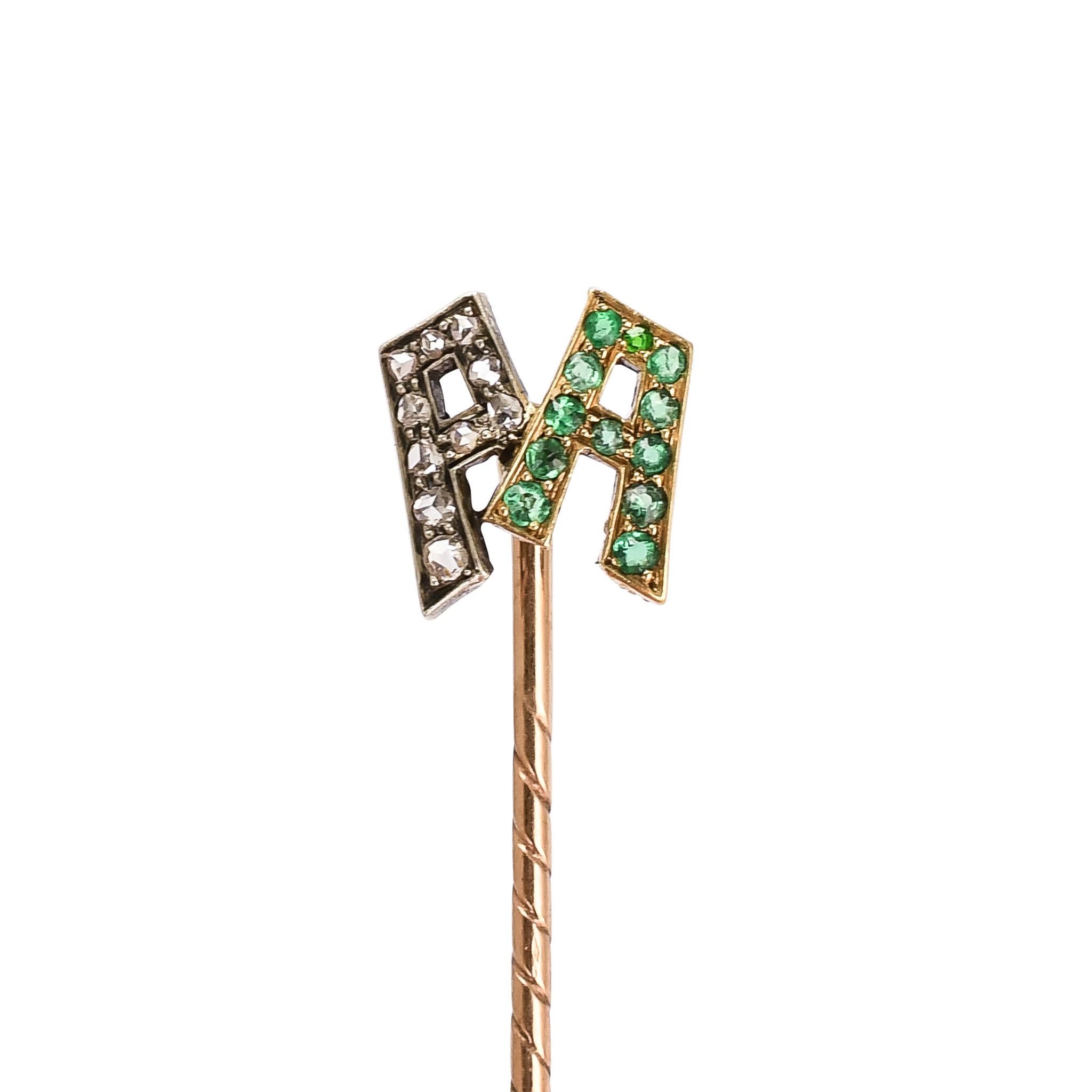 An outstanding antique stickpin featuring the initials PA set in diamonds and emeralds respectively. The font and general styling indicates that it dates from the turn of the 20th century, and it remains in great condition. Crafted in 15k gold and