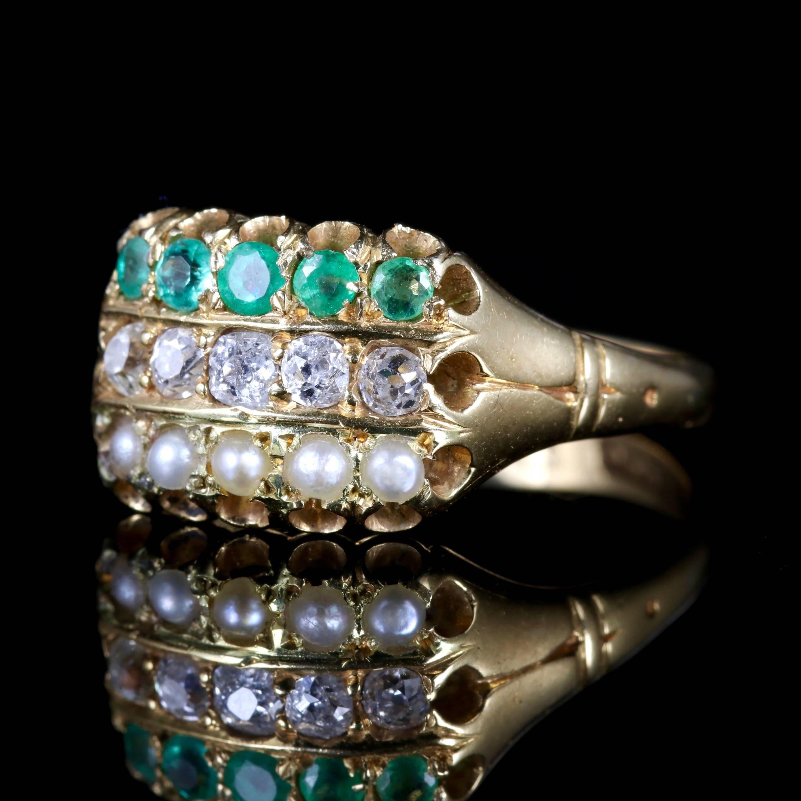 This lovely Victorian 18ct Yellow Gold is dated Birmingham 1882.

The ring boasts a trilogy of gemstones, such as rich Emeralds, sparkling Diamonds and lustrous Pearls.

The Diamonds are SI 1 - H colour.

Trilogy means past, present and future or