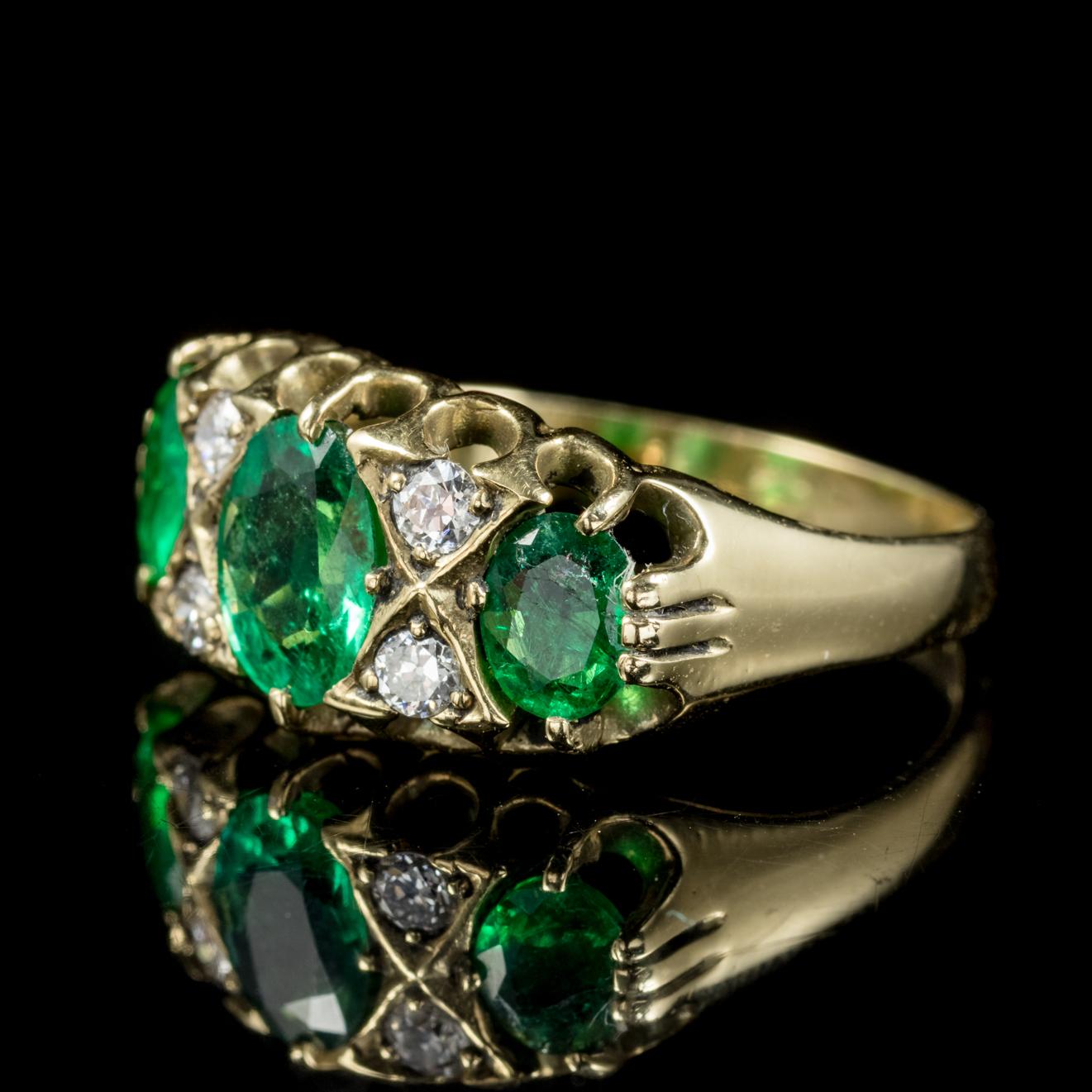This fabulous antique Emerald and Diamond ring is a beautiful Victorian piece, Circa 1900. 

The central natural Emerald is just under 1ct with two smaller Emeralds at either side.

Emerald is the sacred stone of the goddess Venus, It was thought to