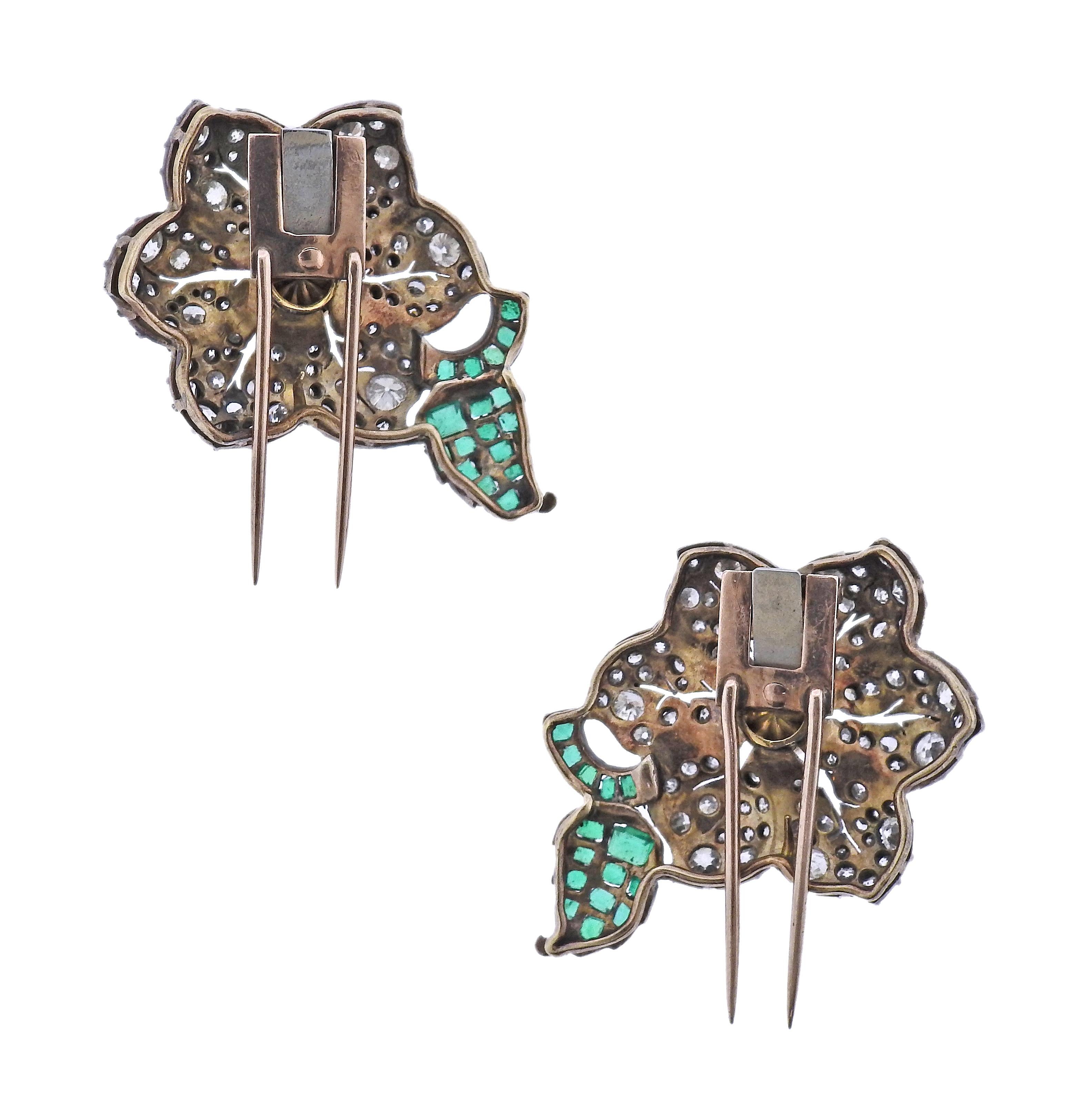 Set of two gold and silver Victorian flower brooches, each set with 6-6.5mm pearl in the center, emeralds and approx. 2.50-2.60ctw in old mine cut diamonds. Each brooch measures 36mm x 25mm. Weight of the set - 17.9 grams.