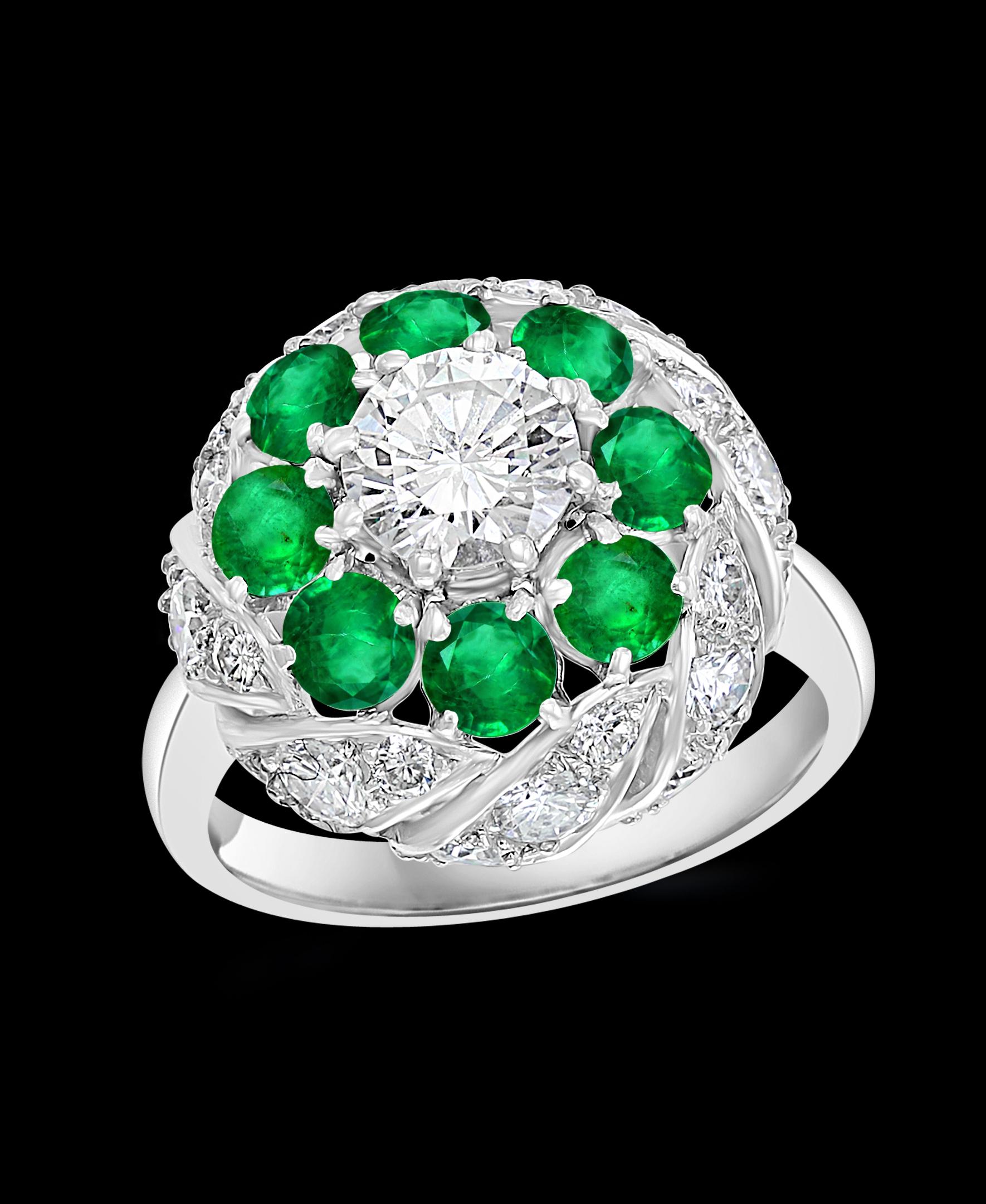 Antique Victorian Emerald & Solitaire Diamond Ring In Platinum Estate Size 5
Old Treasure 
Solitaire Approximately  1 Ct Brilliant Round Diamond in the C enter.
Surrounded by round shape Emeralds , each approximately 10 pointer .
Total weight of the